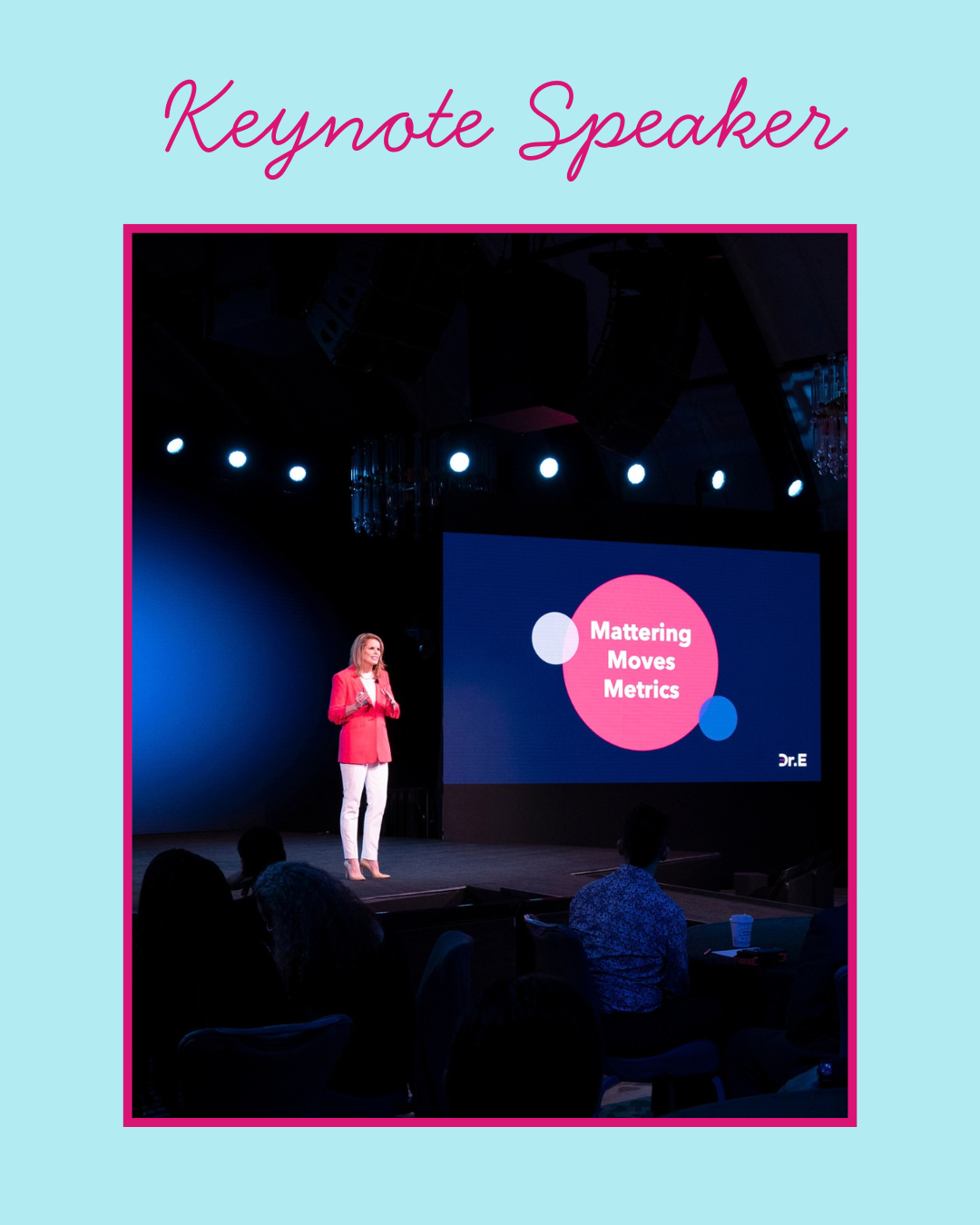 A woman presenting on a stage with a large screen displaying 'Mattering Moves Metrics' and the name 'Dr. E' at a conference.