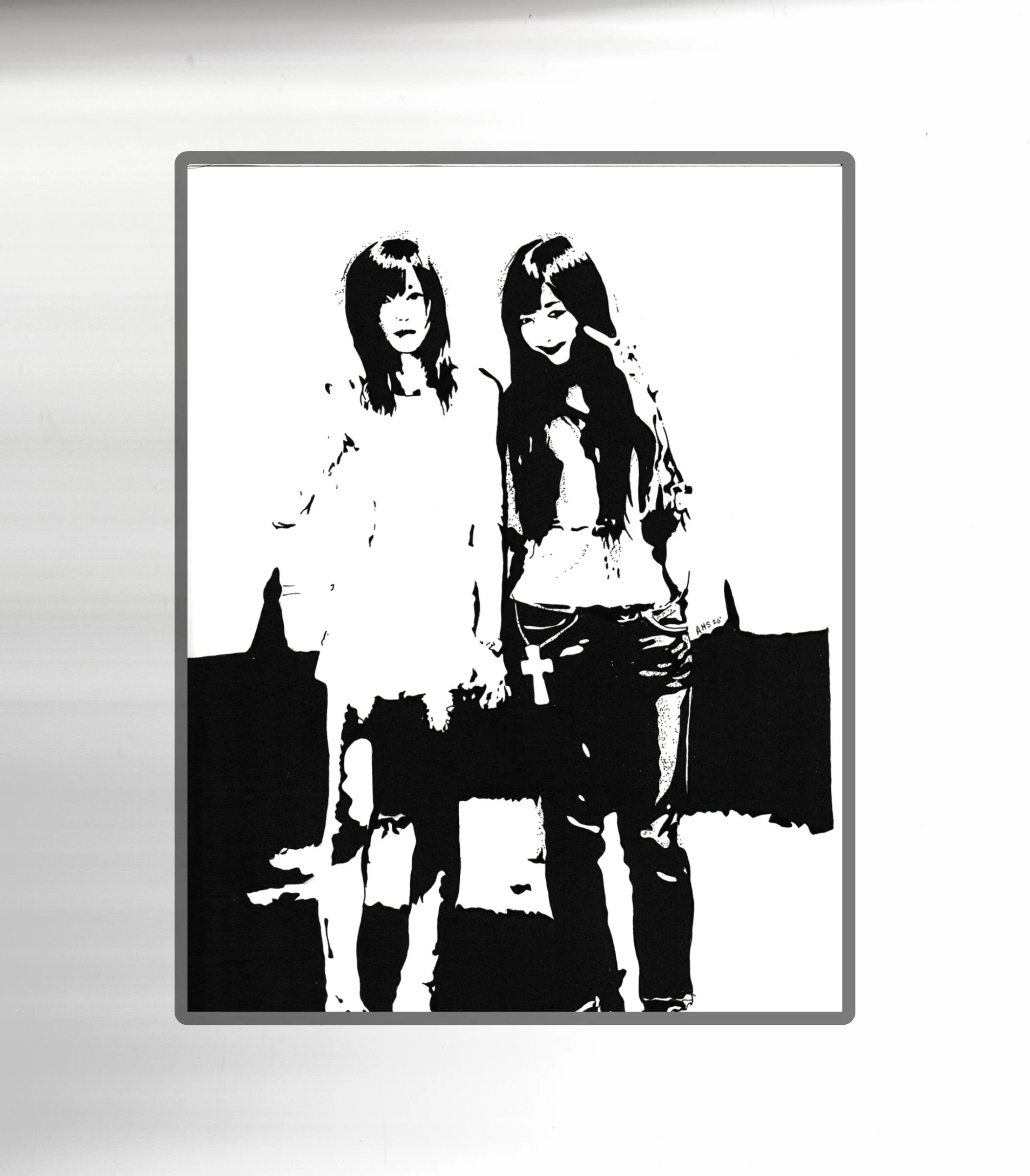Black and white stencil art of two women with long hair, side by side, on a white surface.