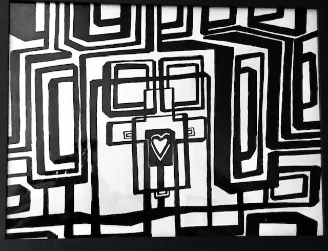 Black and white abstract pattern with geometric lines in the shape of a cross and a central heart symbol.