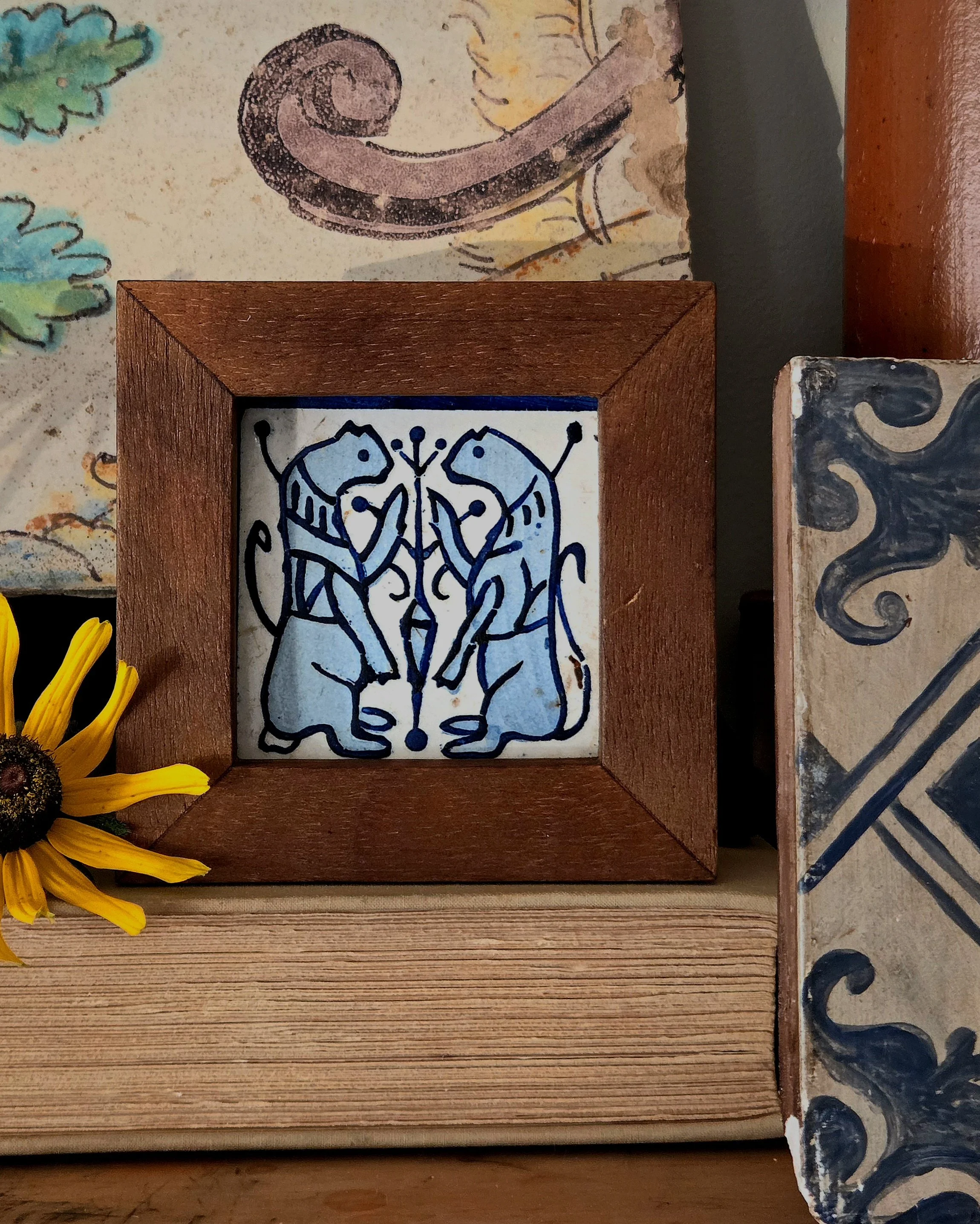 Medieval-revival framed tile, inspired by the Socarrat tradition.