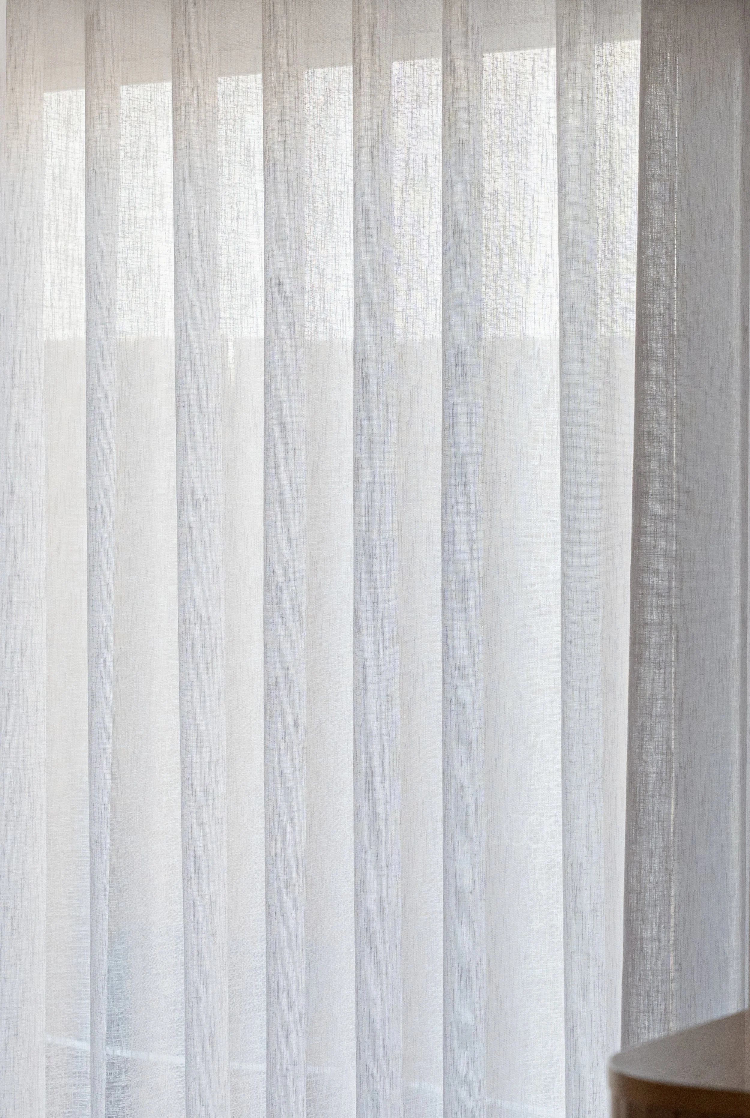 Close-up of sheer curtain fabric in even folds
