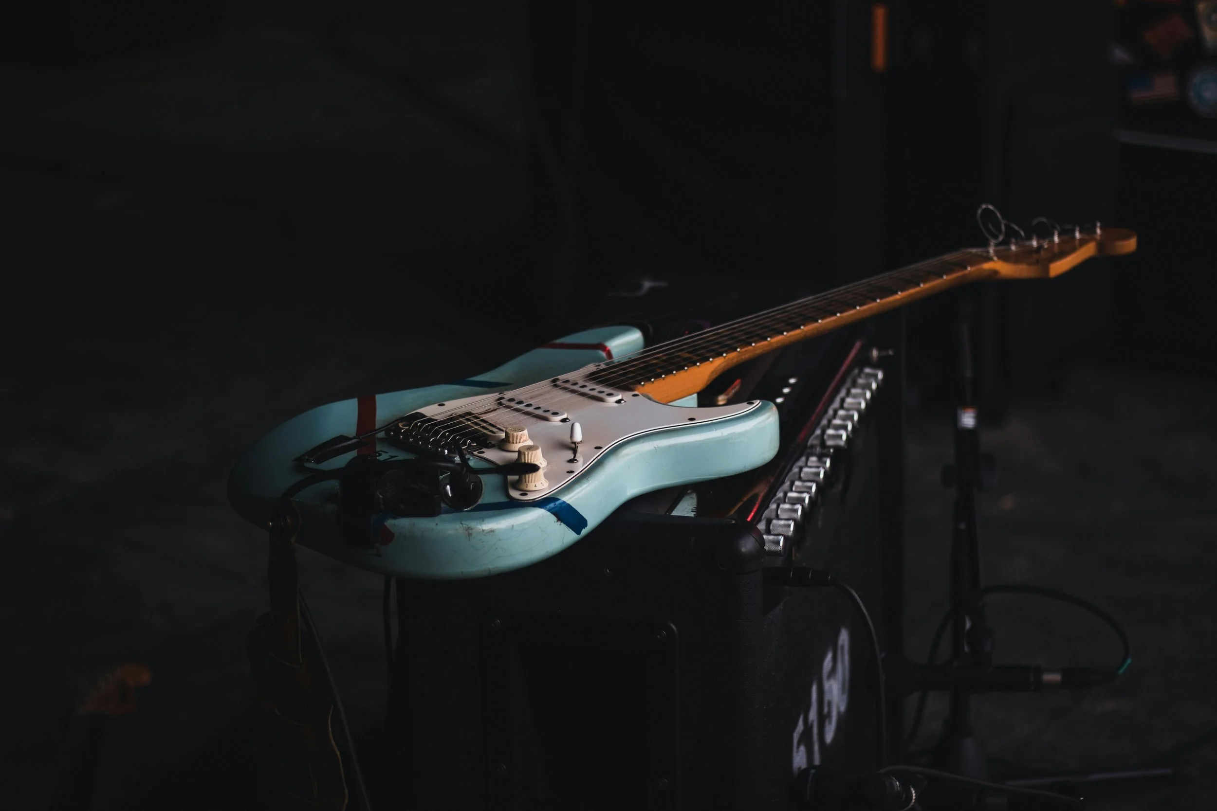 photo of electric guitar on an amplifier