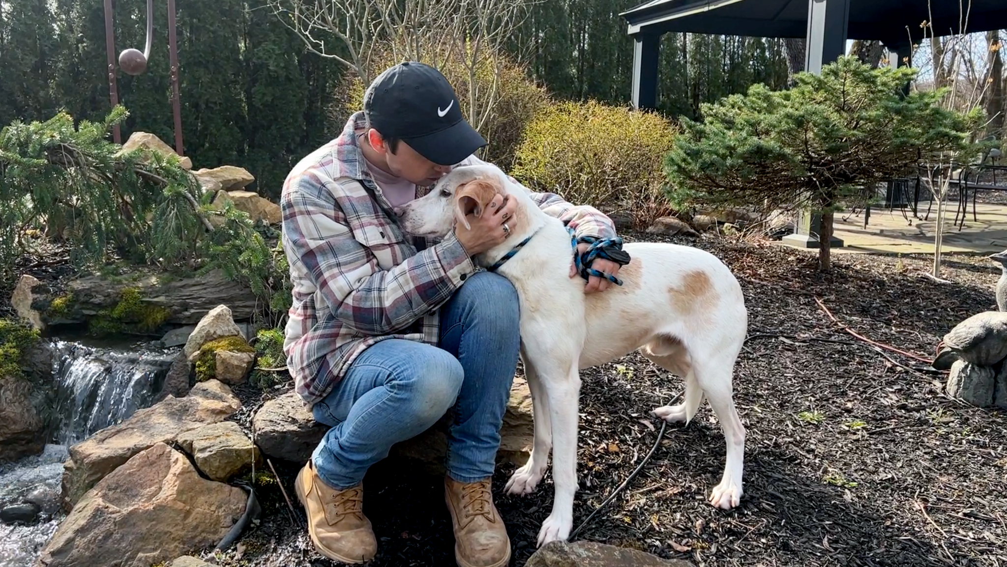 David Scott Weitz photographing a staff member with a dog at Janry Pet Resort 