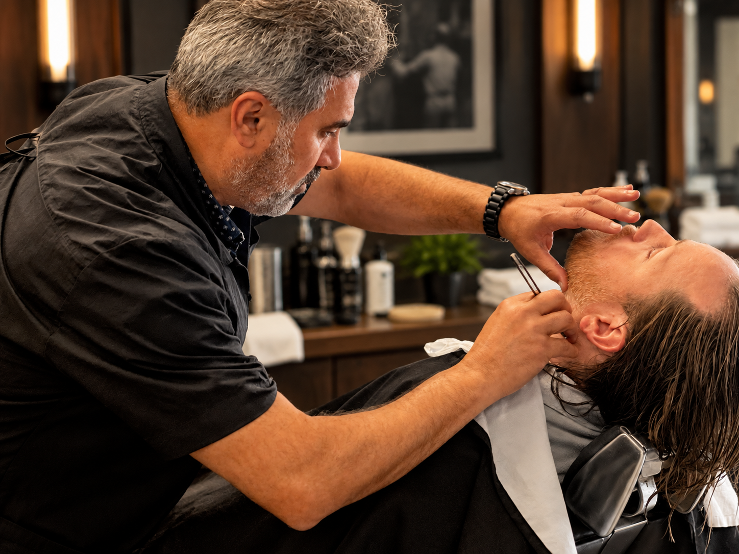 David Scott Weitz photographing a male barber at Players Barber Shop in Hatboro, Pennsylvania