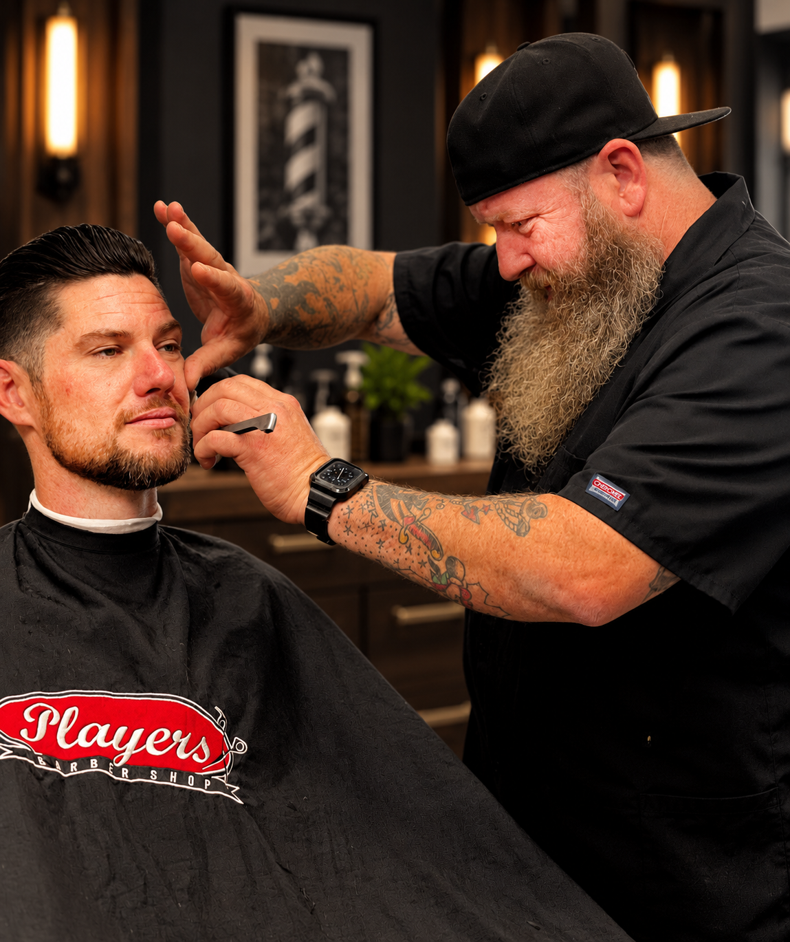  Photography by David Scott Weitz of a male barber cutting a young man's hair at Players Barber Shop in Hatboro, Pennsylvania 