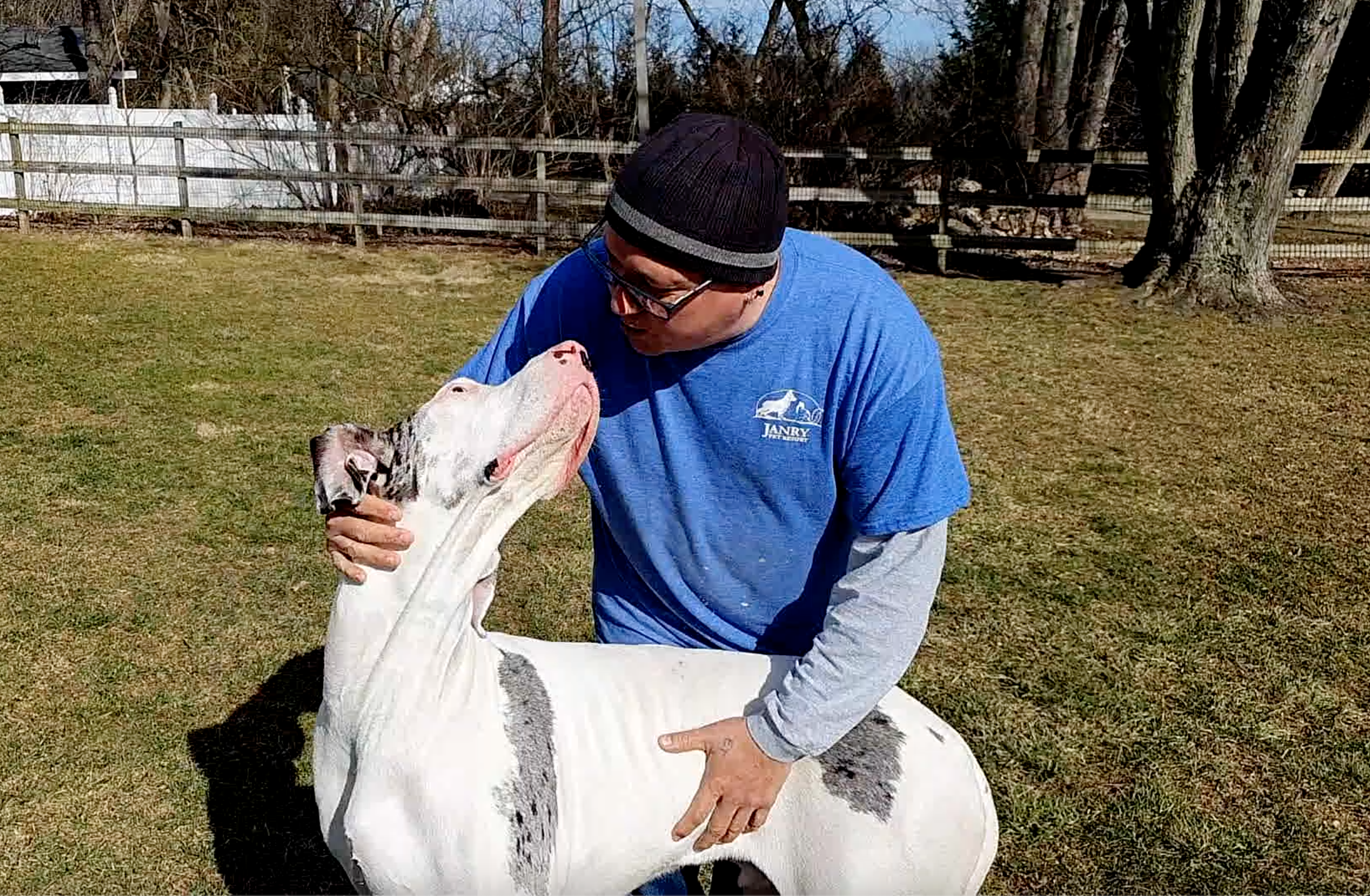 David Scott Weitz photographing a staff member outside with a Great Dane at Janry Pet Resort 