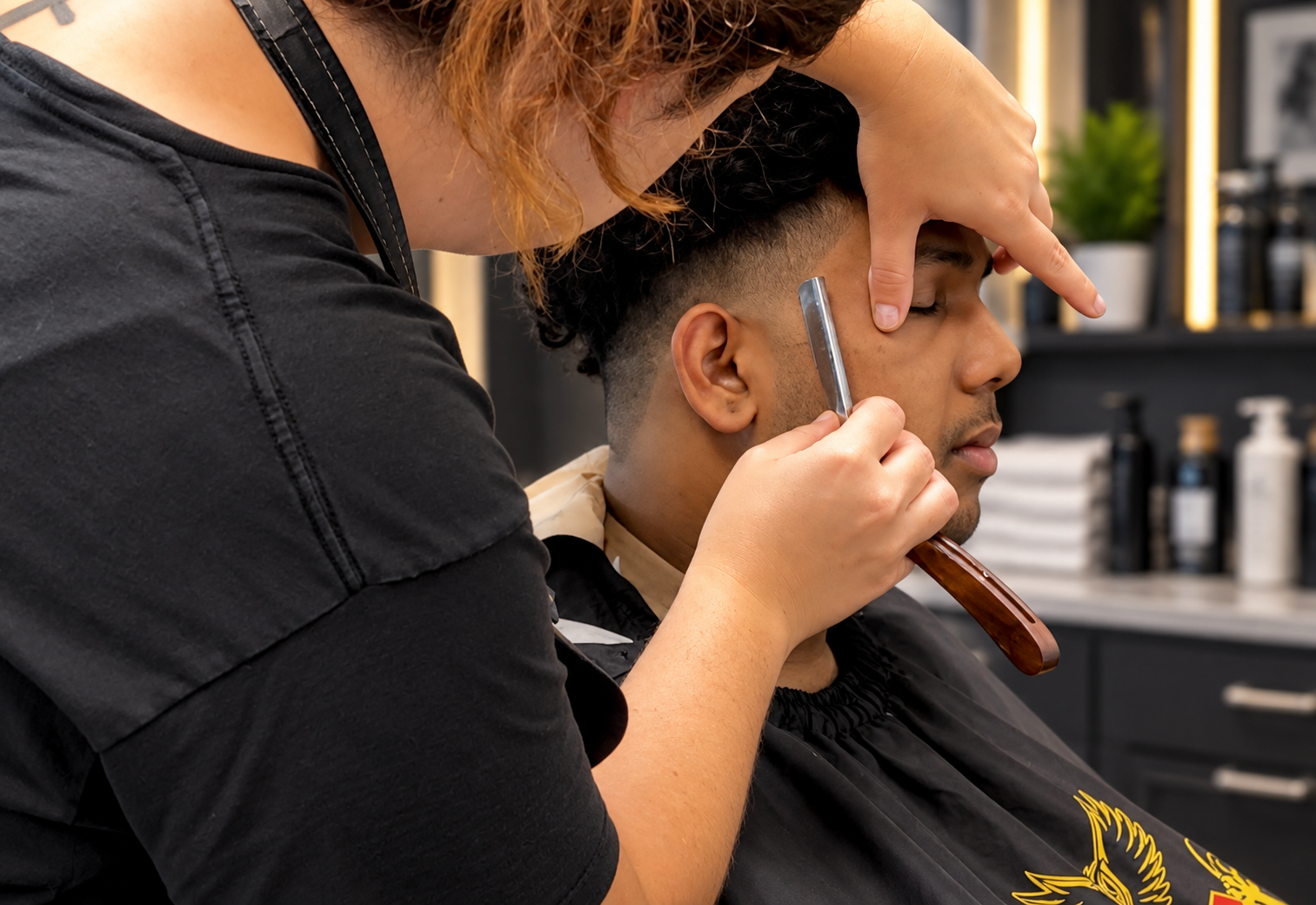 David Scott Weitz photographing a female barber at Players Barber Shop in Hatboro, Pennsylvania