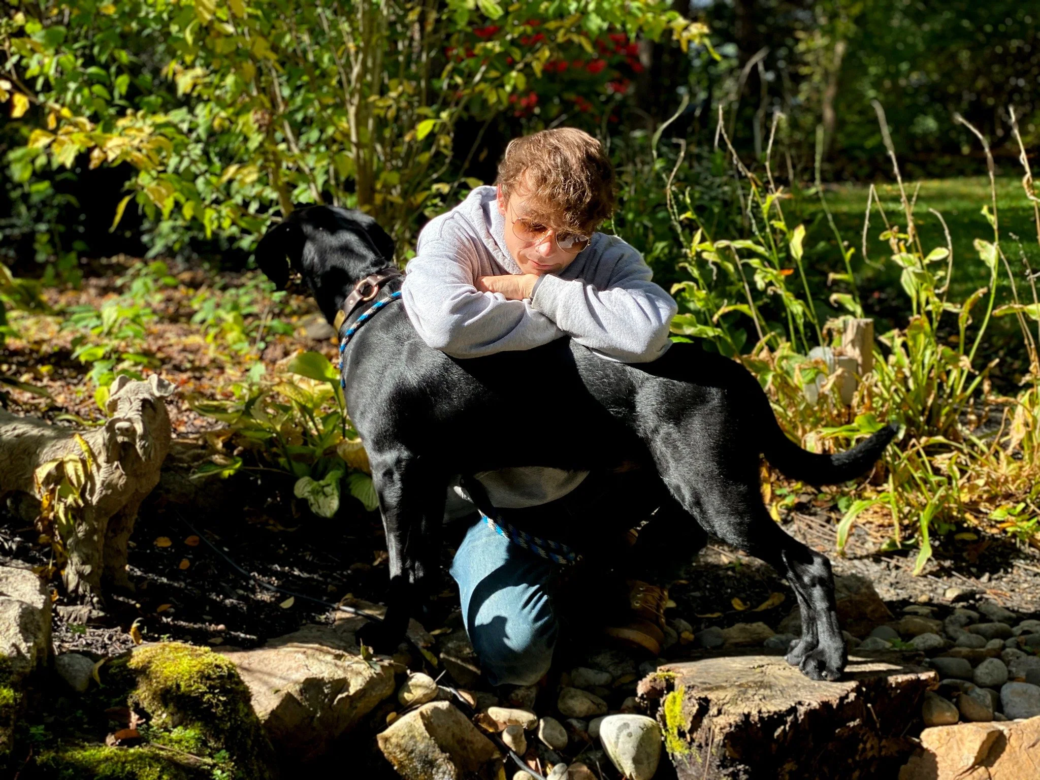 David Scott Weitz photographing a staff member with a dog at Janry Pet Resort 