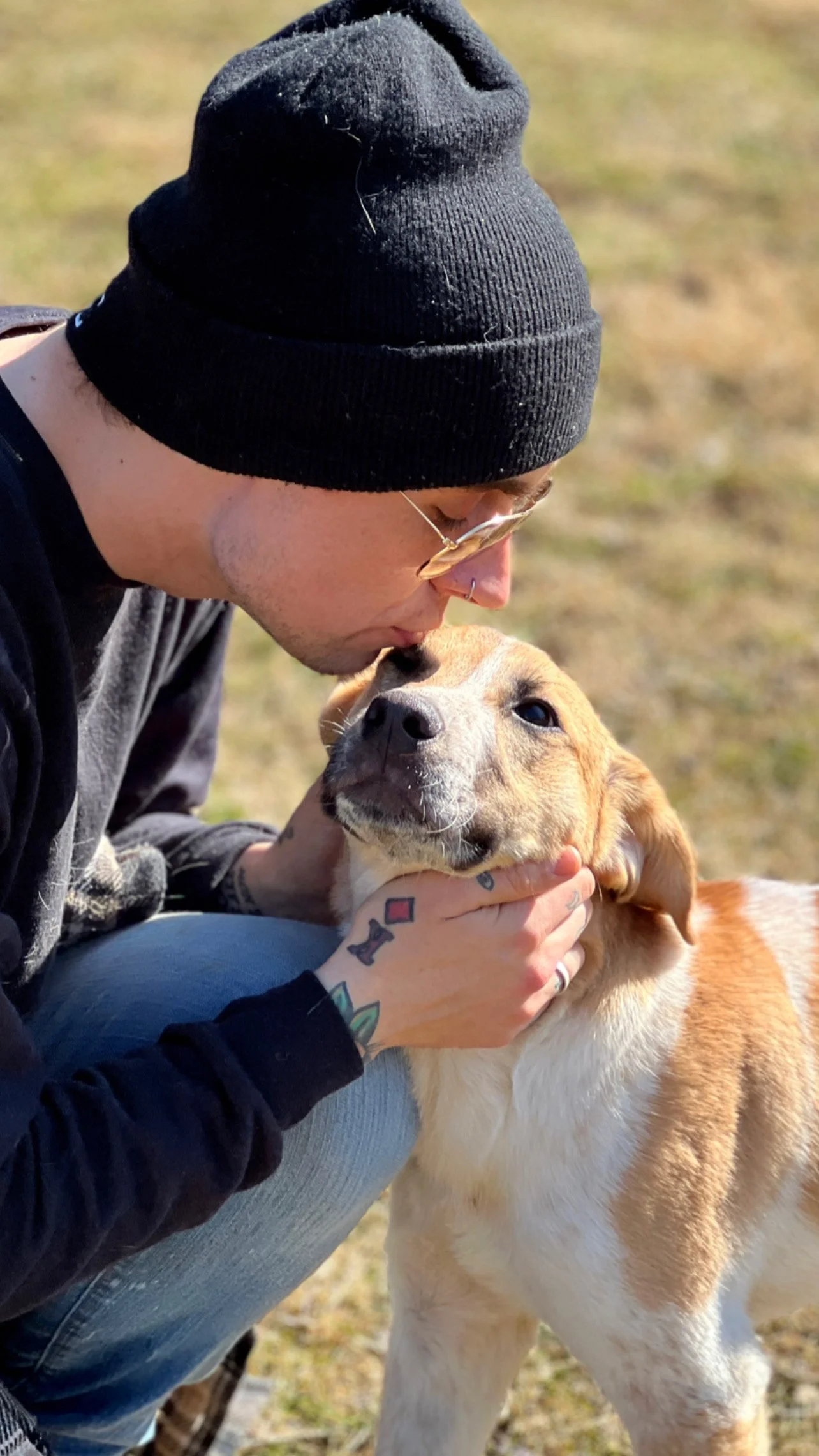 David Scott Weitz photographing a staff member outside with a dog at Janry Pet Resort 