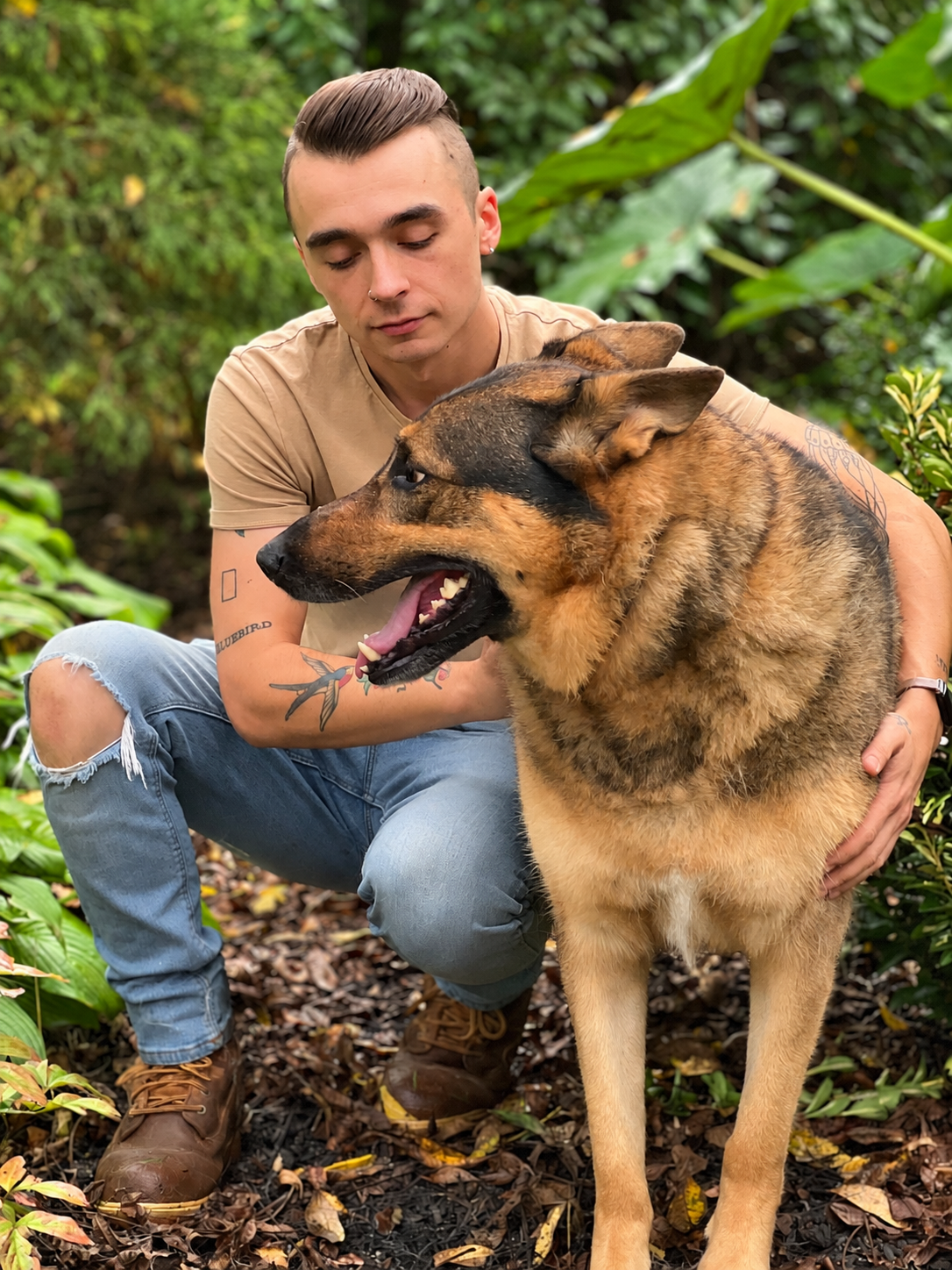 David Scott Weitz photographing a staff member outside with a dog at Janry Pet Resort