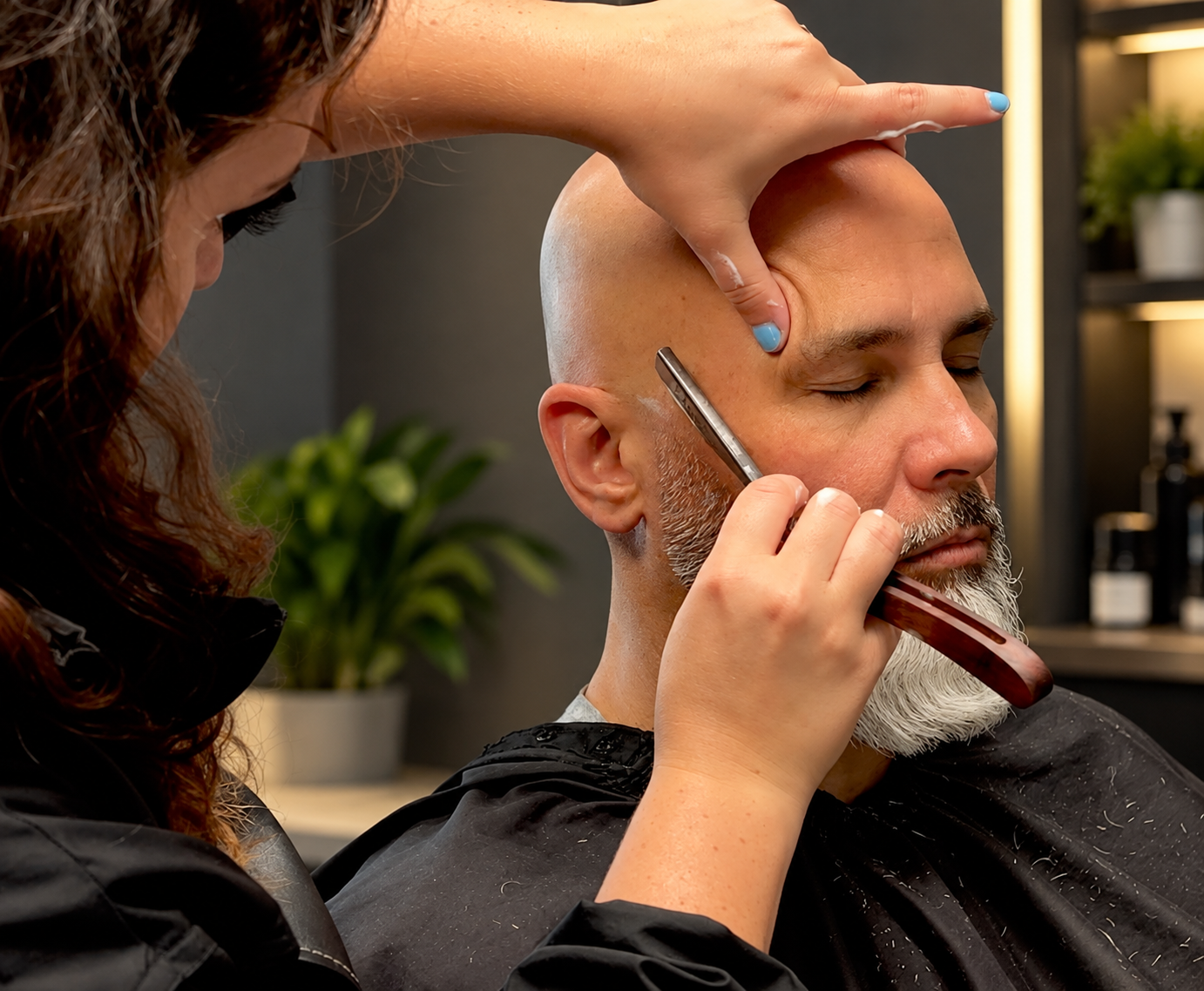 David Scott Weitz photographing a female barber at Players Barber Shop in Hatboro, Pennsylvania