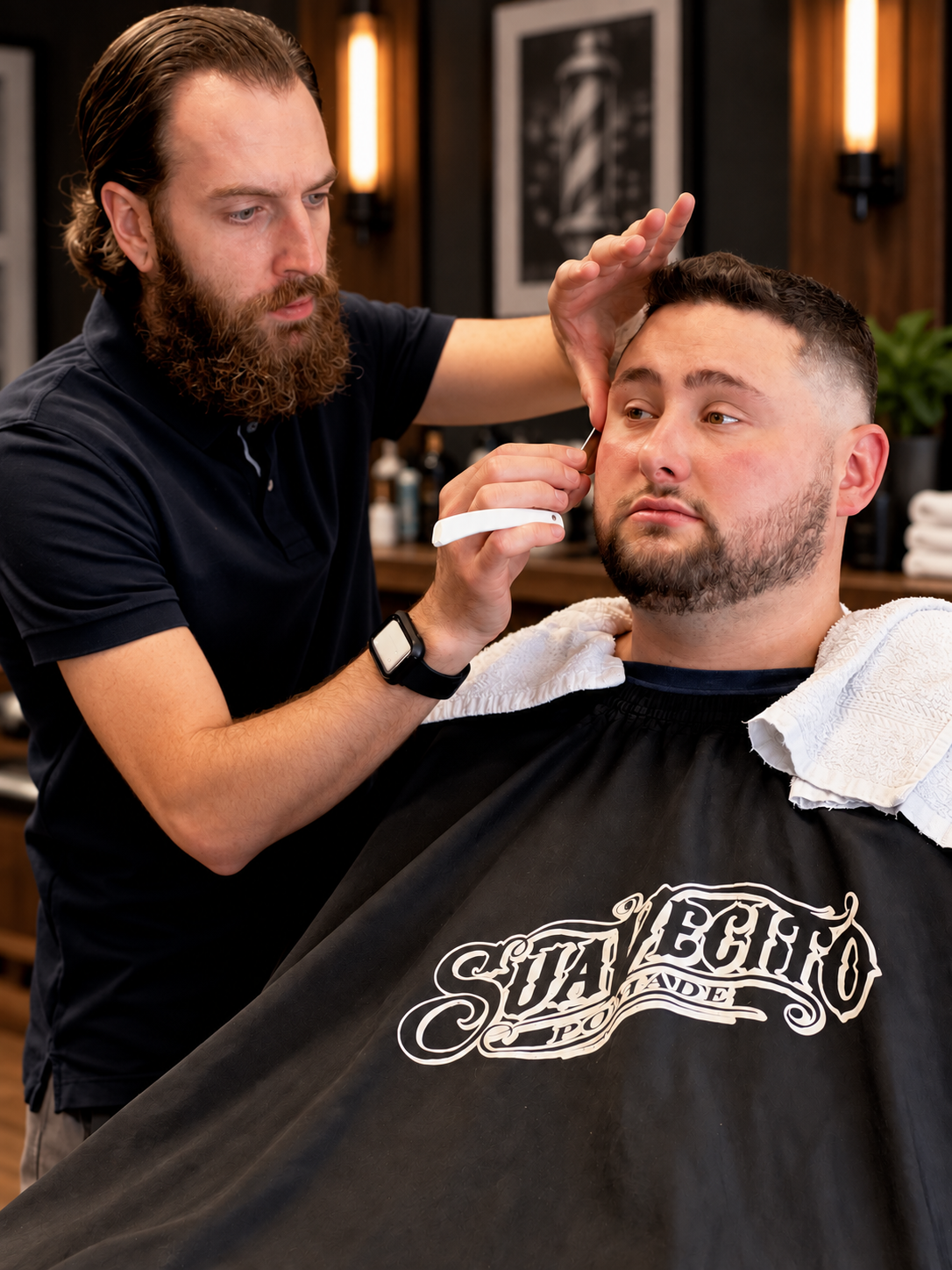 Photography by David Scott Weitz of a male barber cutting a young man's hair at Players Barber Shop in Hatboro, Pennsylvania