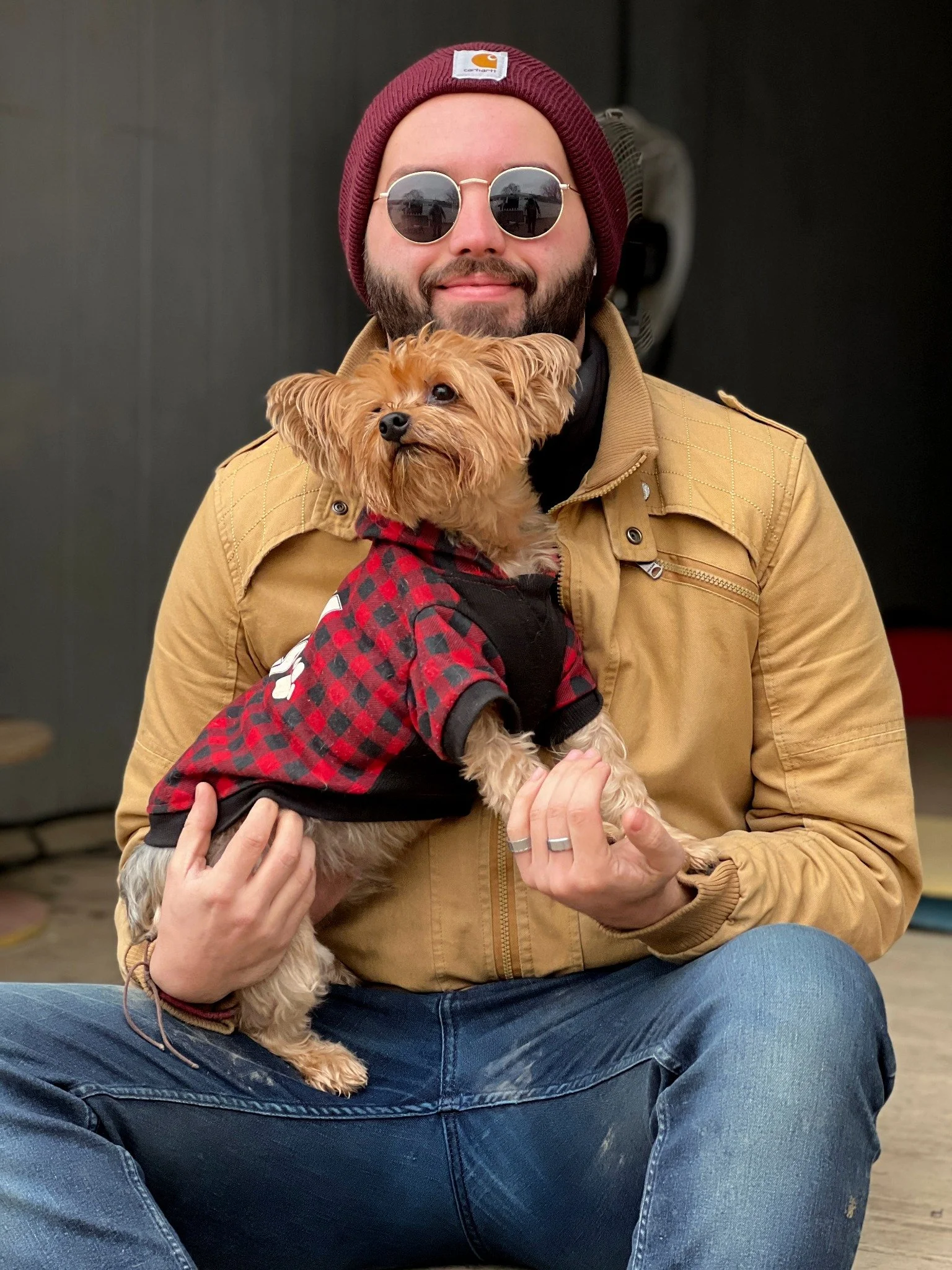 David Scott Weitz photographing a staff member outside with a dog at Janry Pet Resort 
