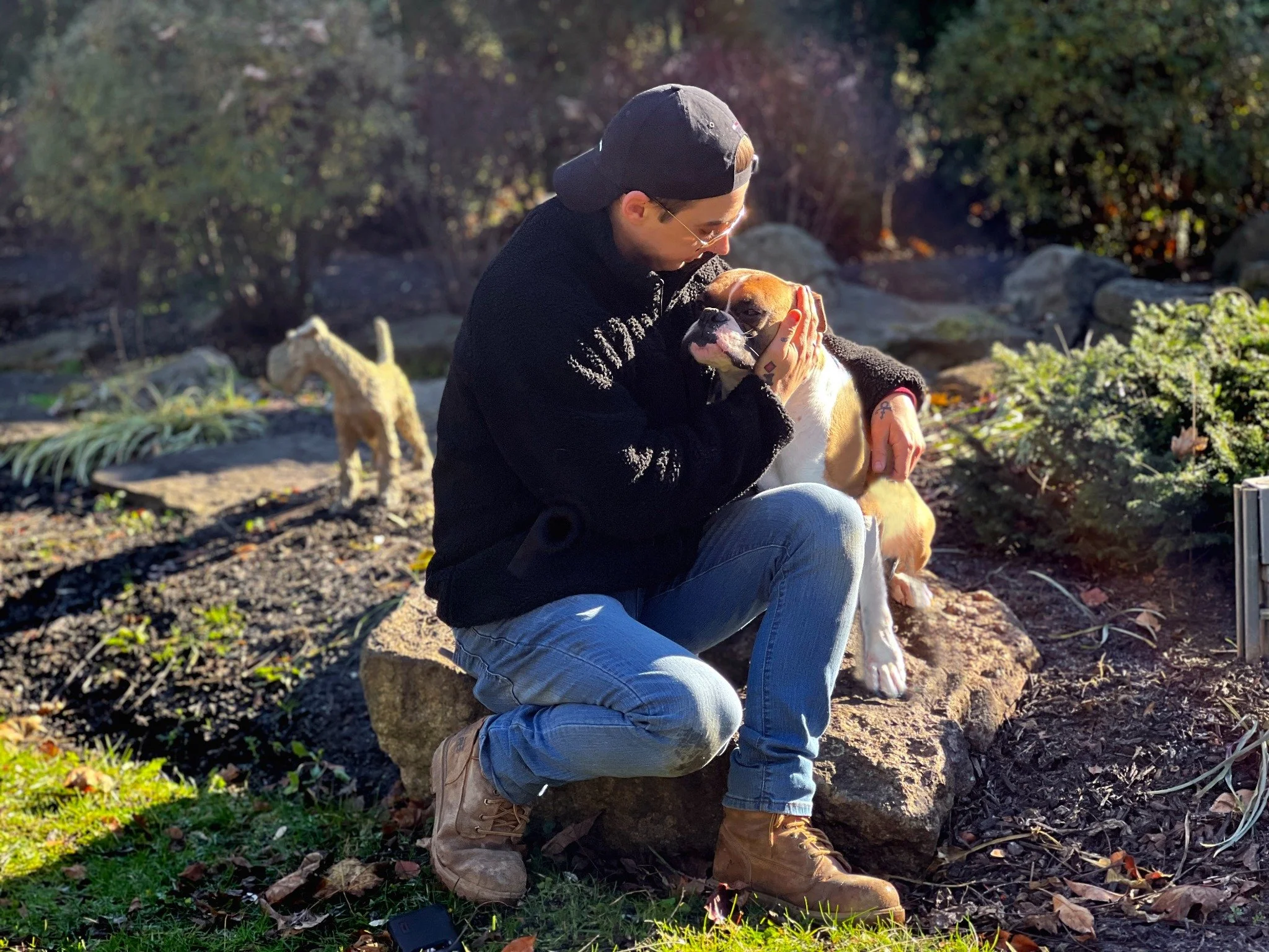 David Scott Weitz photographing a staff member with a dog at Janry Pet Resort 