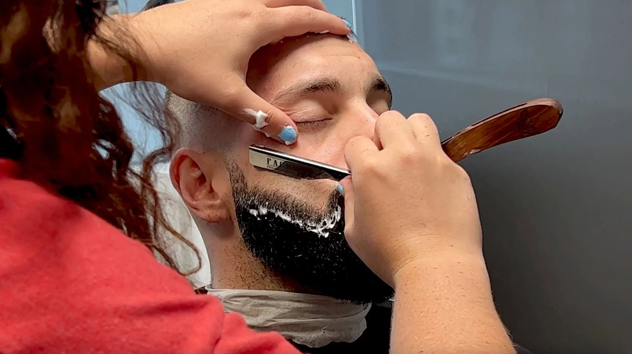 David Scott Weitz photographing a female barber at Players Barber Shop in Hatboro, Pennsylvania 