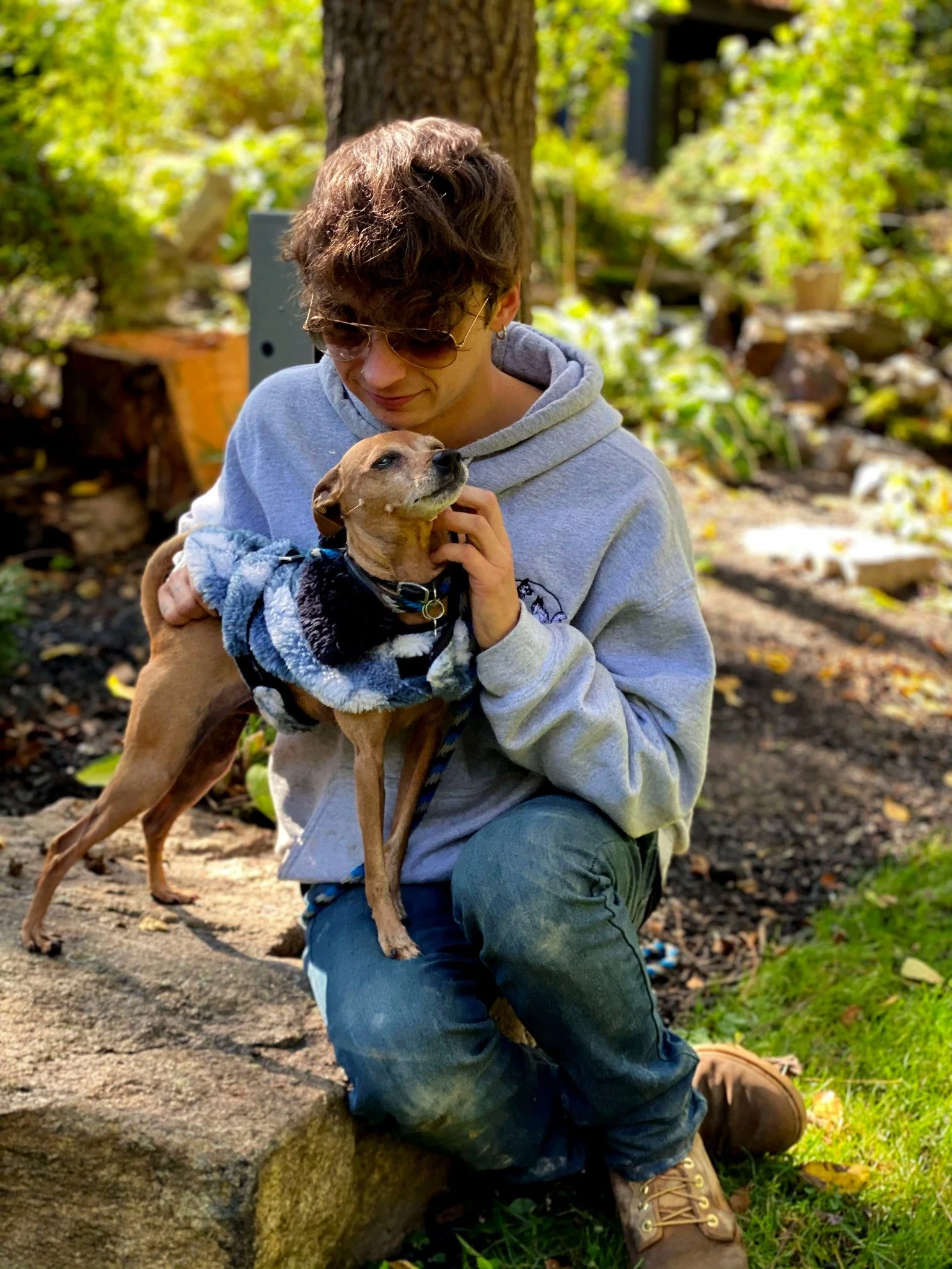 David Scott Weitz photographing a staff member with a dog at Janry Pet Resort 