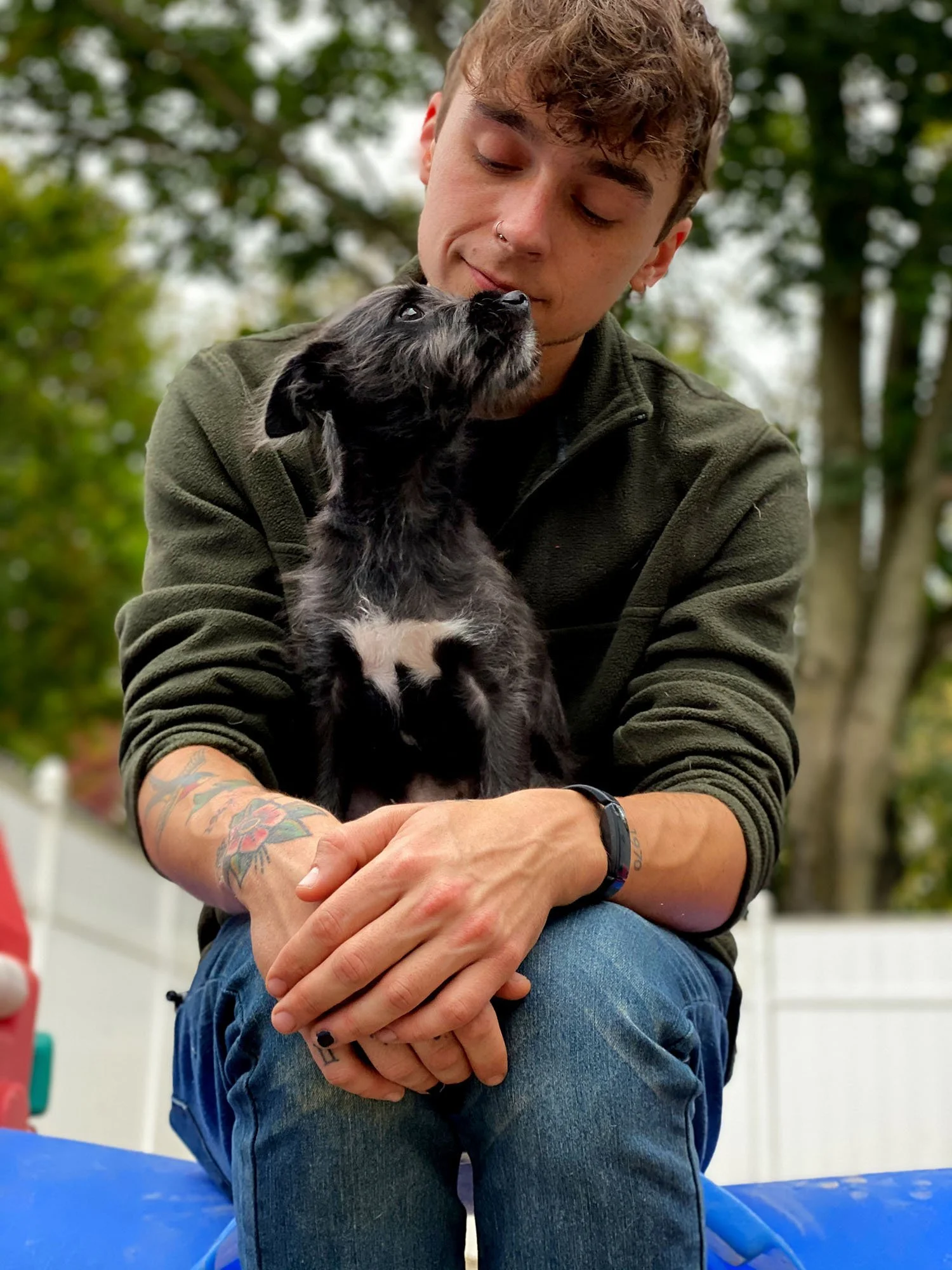 David Scott Weitz photographing a staff member with a dog at Janry Pet Resort 