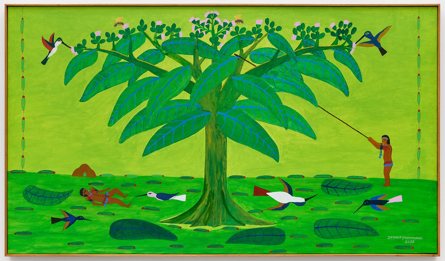 A colorful painting of a large green tree with blue veins on the leaves, surrounded by hummingbirds, a man with a spear, and fallen leaves on the ground, with a bright green background.