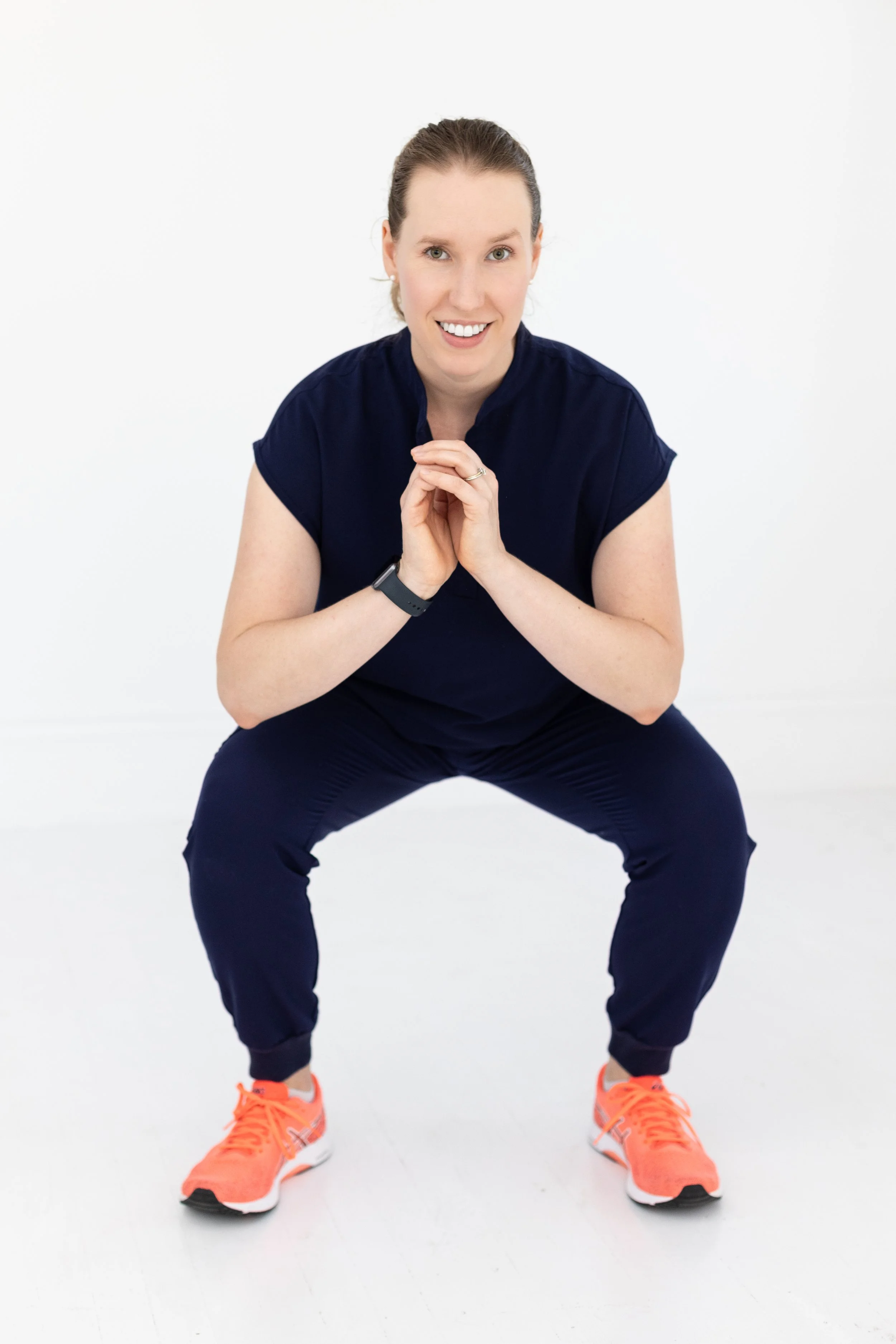 Dr. Savannah perform a squat