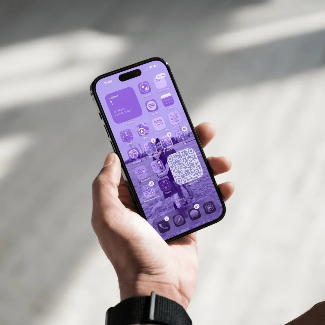 Phone displays multiple apps and a qr code on the home page