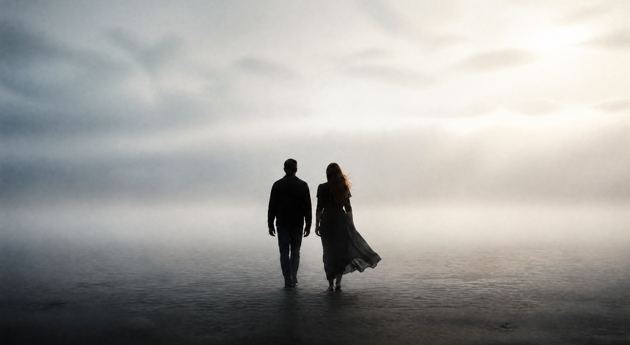 A man and woman walking together, representing human connection and belonging