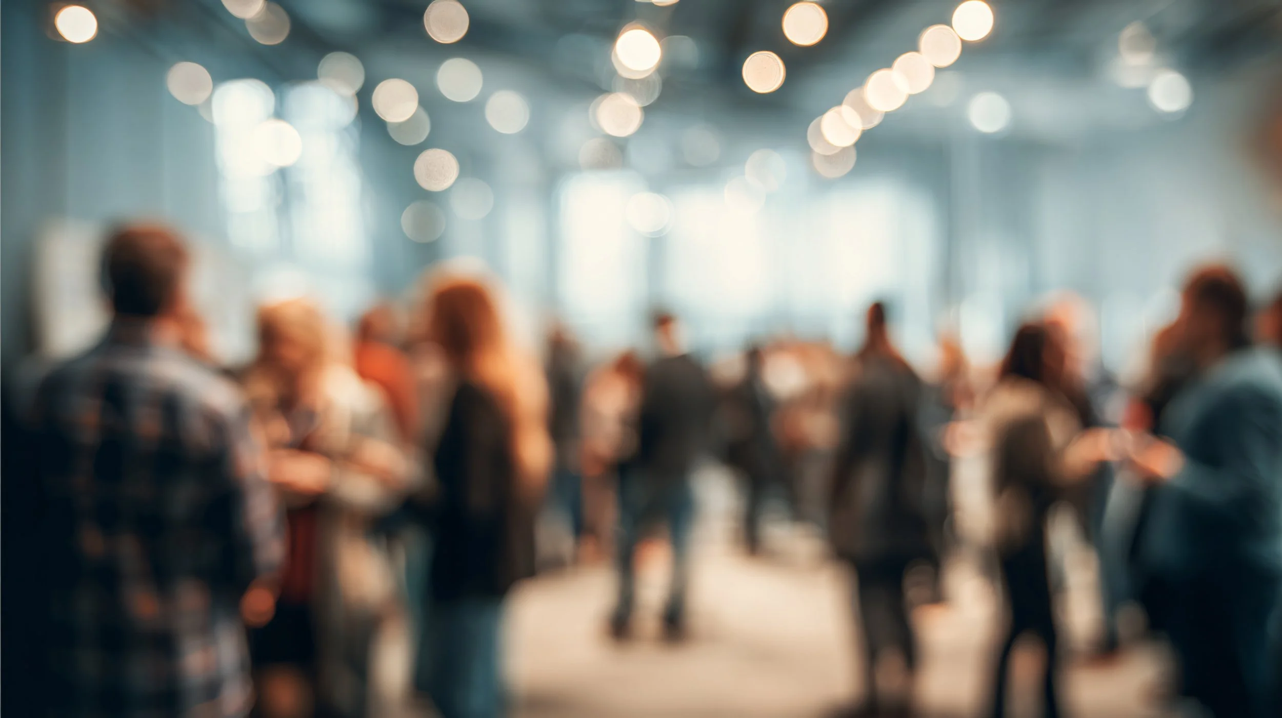 A blurred image of a crowd of people representating feeling disconnected from humanity