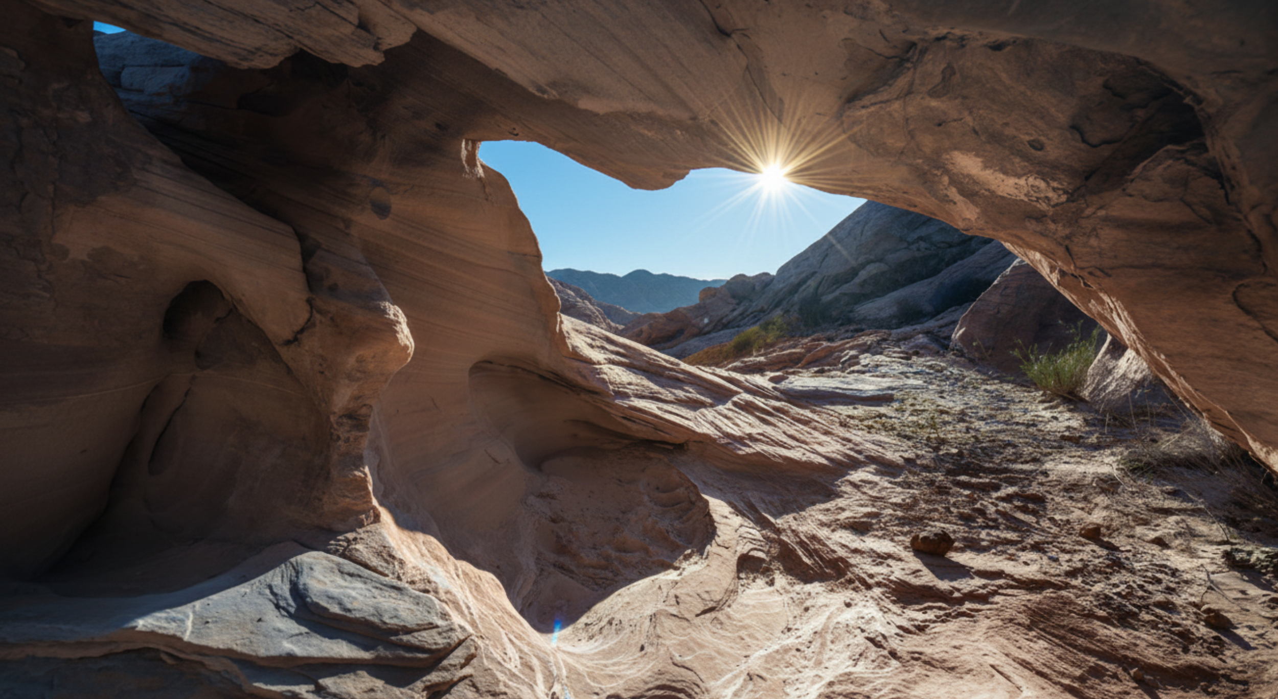 Sun shining through a narrow opening in a mountain representing a self development journey to growth and change