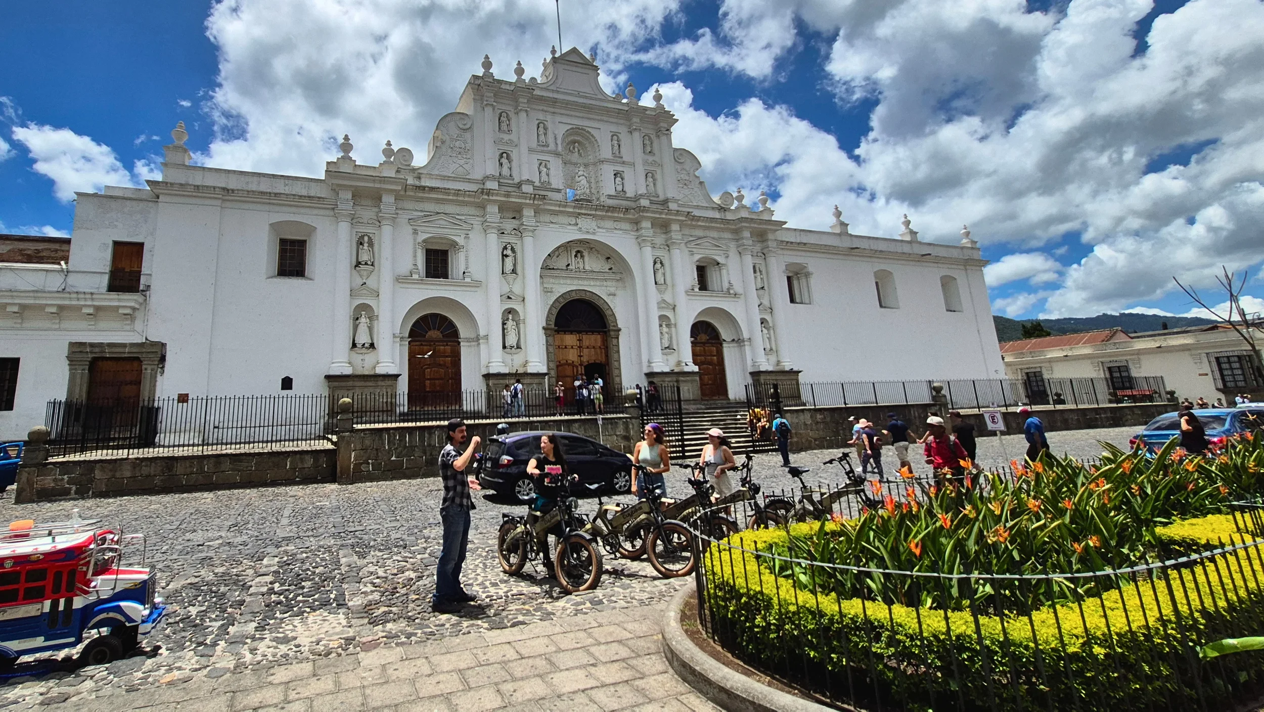 e-bikes in front of the cathedral at parque central