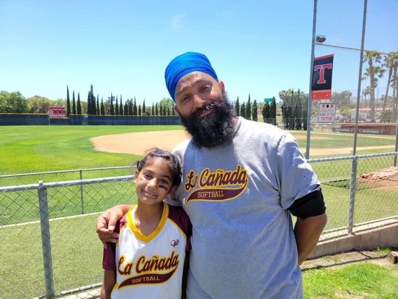 Amar Malik with his daughter at the La Cañada softball field