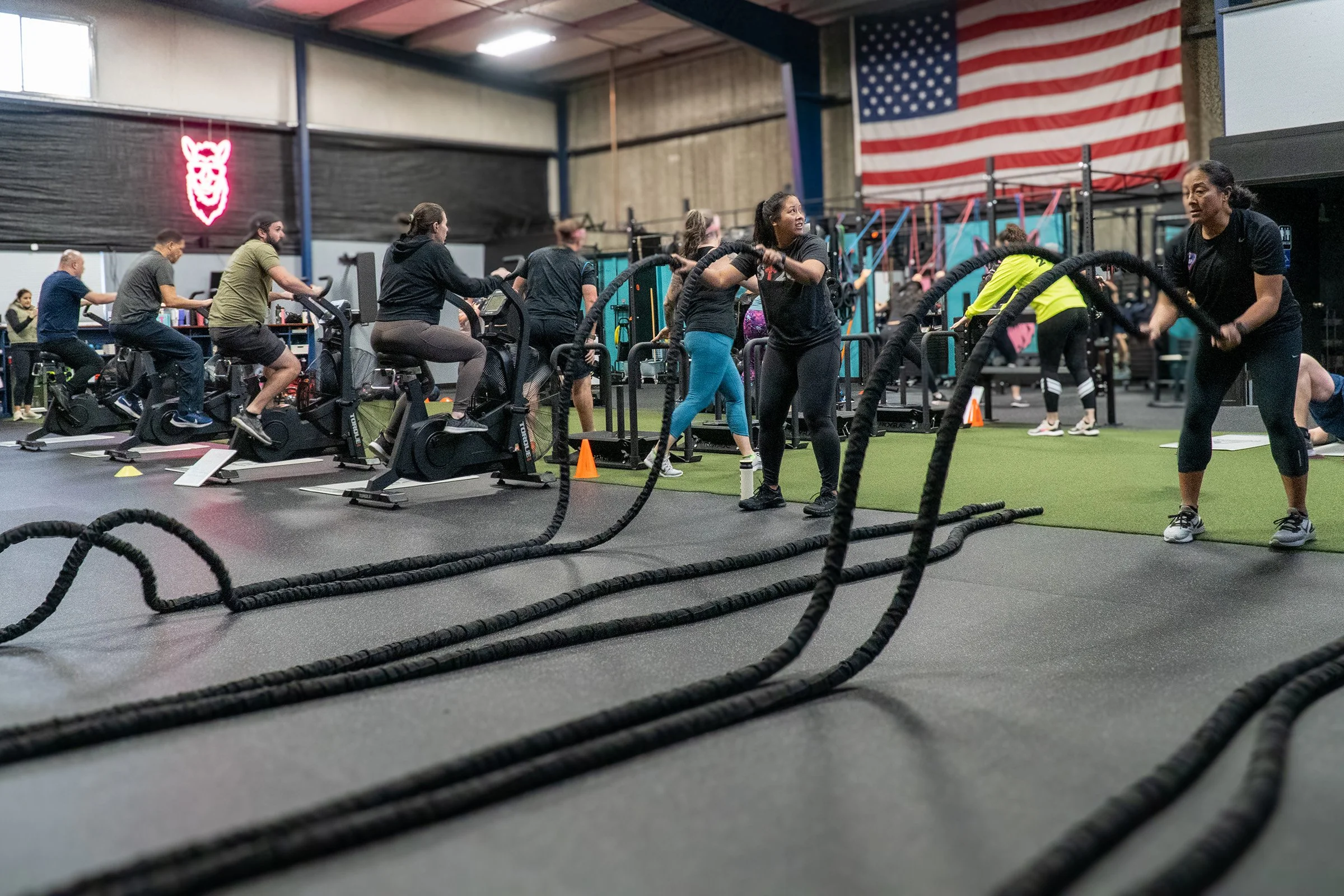 Pink Llama Fitness members doing coach-led conditioning in Renton