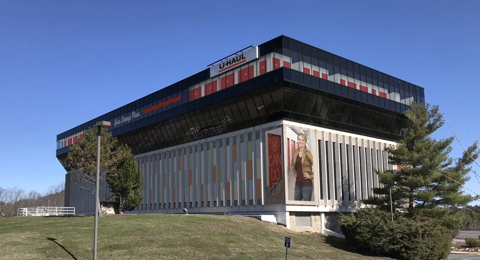 Completed Framingham U-Haul self-storage facility showing the converted former Genzyme office building.