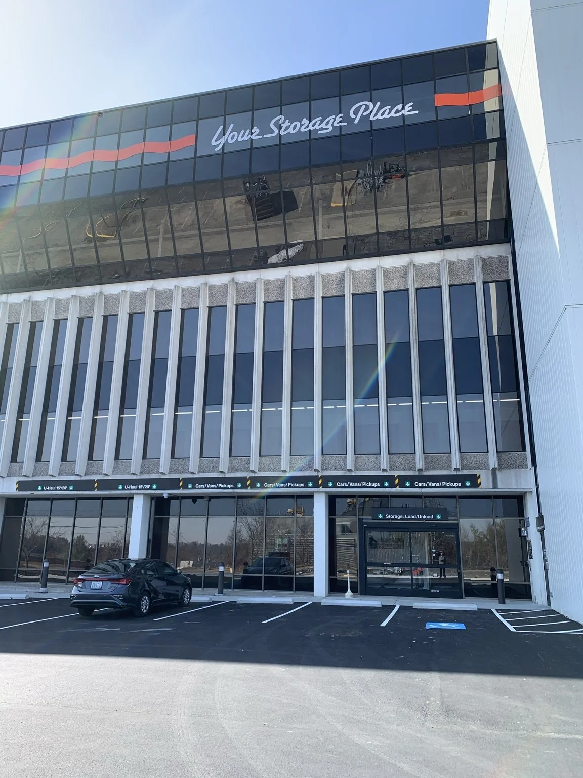 Front entrance and indoor loading area at the completed U-Haul self-storage facility in Framingham, Massachusetts.