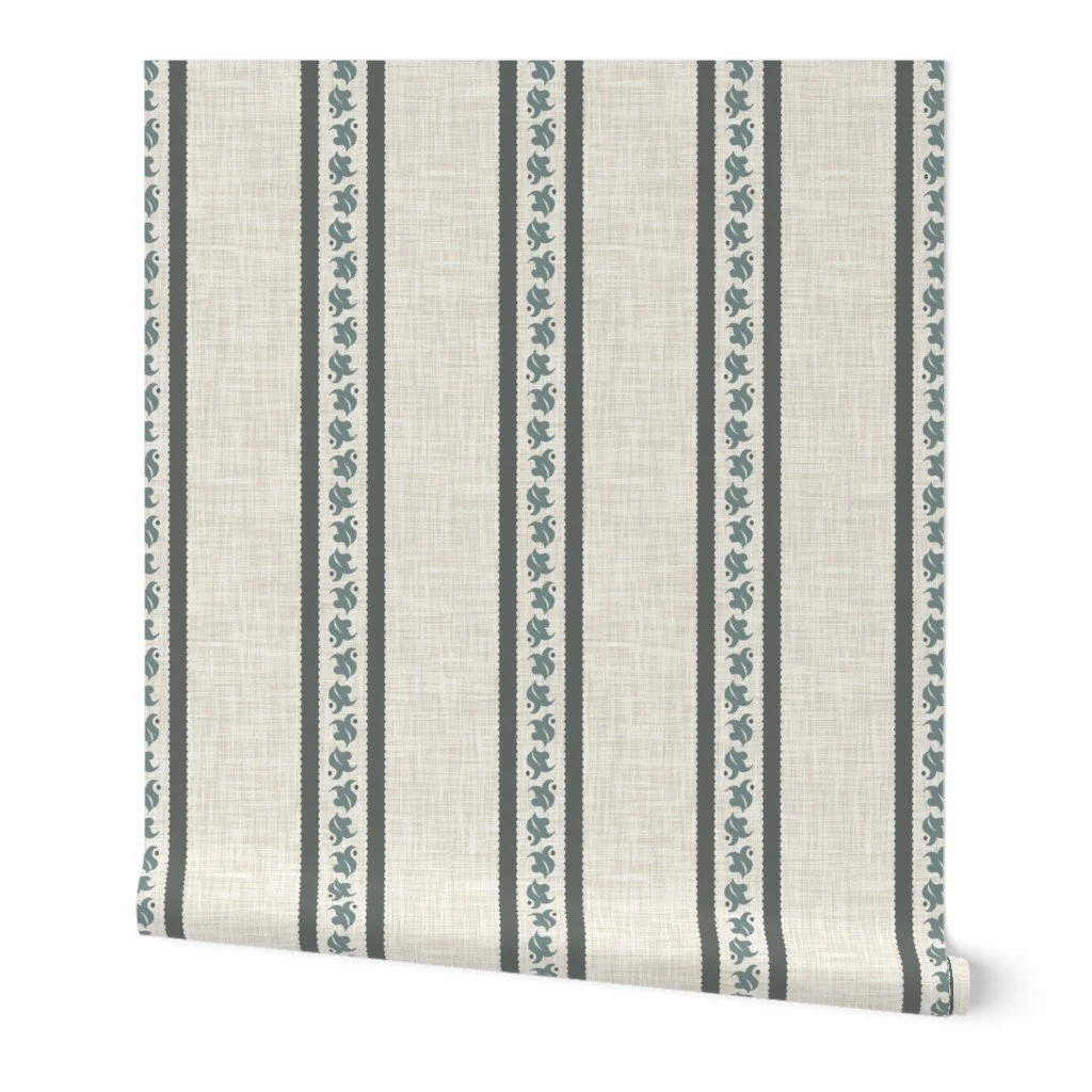 Alt text: Linen-textured wallpaper roll displaying vertical wide stripes in charcoal-gray adorned with stylized botanical vine motifs on an off-white ground.