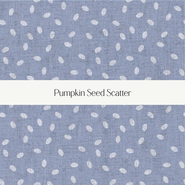 Close-up of fabric with a blue background and white pumpkin seed pattern, labeled 'Pumpkin Seed Scatter'.