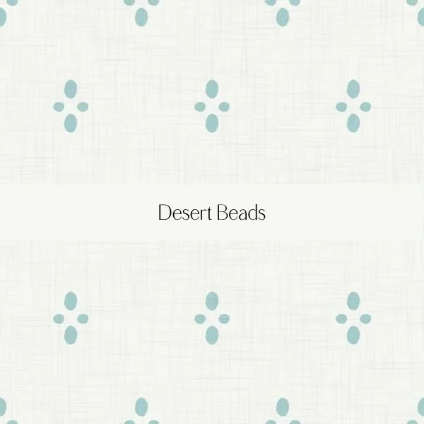Pattern of light blue desert beads on a textured cream background with the words 'Desert Beads' in the center.