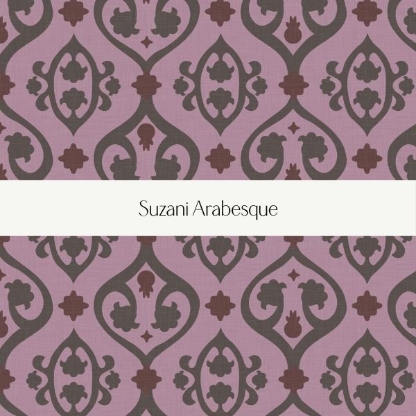 Book cover with a purple and brown ornate floral pattern and a white band in the middle displaying the title 'Suzani Arabesque'.