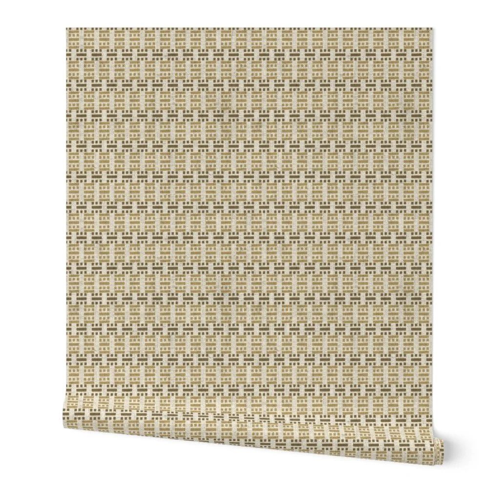 Textured wallpaper roll displaying a woven cane lattice pattern in warm ochre, tan, and cream tones.