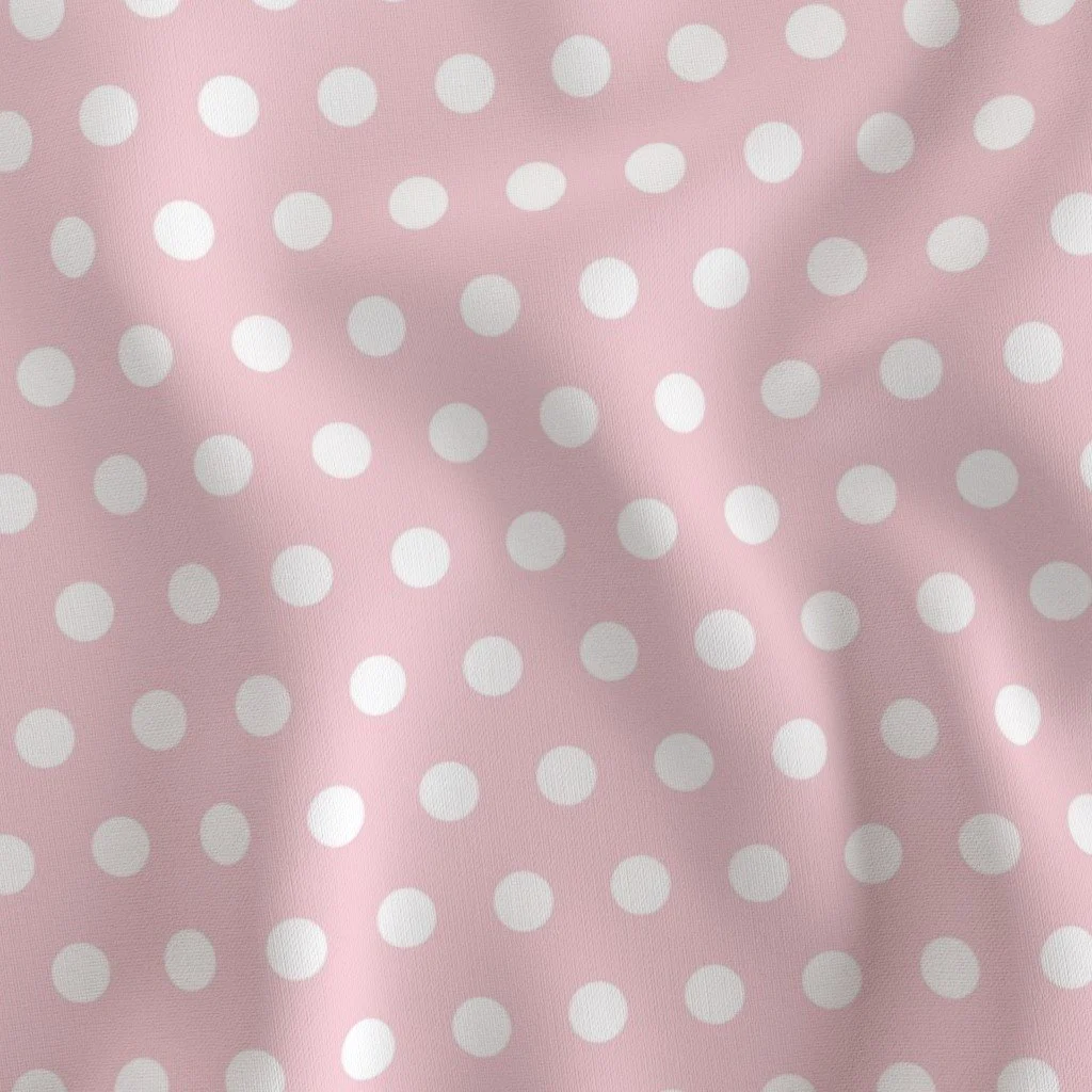 Pink fabric with white polka dots.