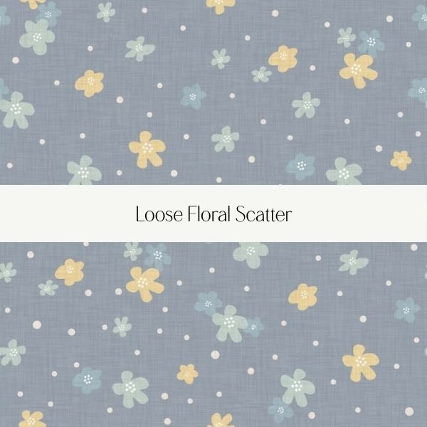 A fabric pattern with a loose floral scatter pattern, featuring yellow, light blue, and green flowers on a gray background.