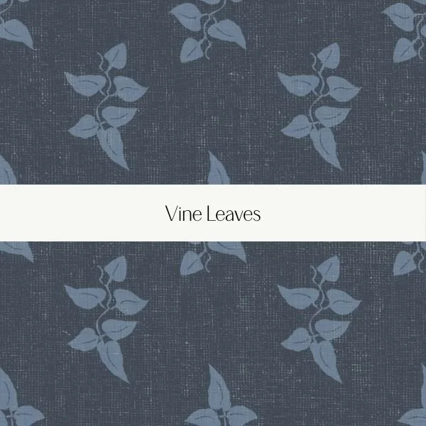 Pattern of vine leaves on fabric with a white label reading 'Vine Leaves'