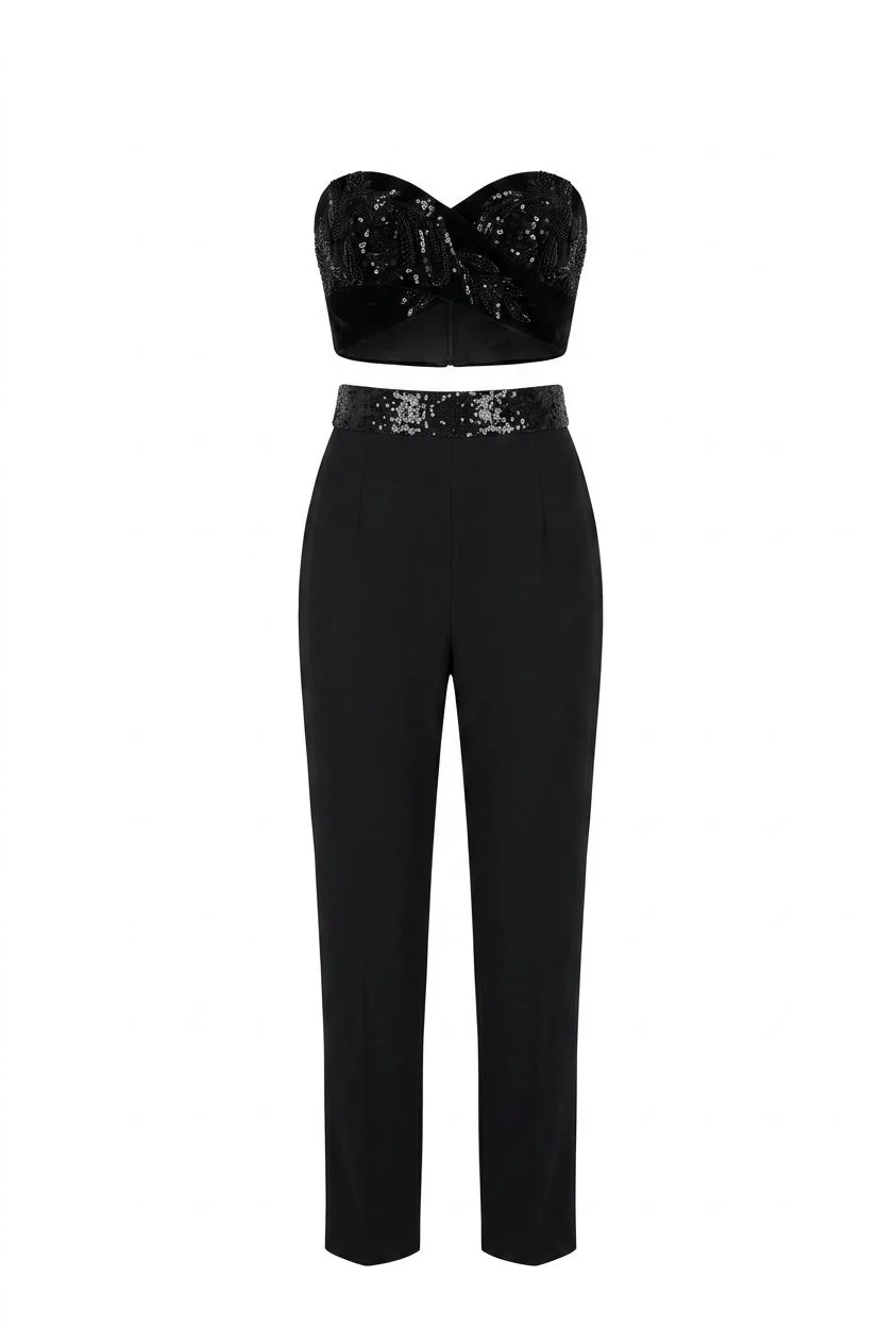 Cushnie Et Ochs Spring 2015 runway look 12. Black jumpsuit with hand-embroidered beading.