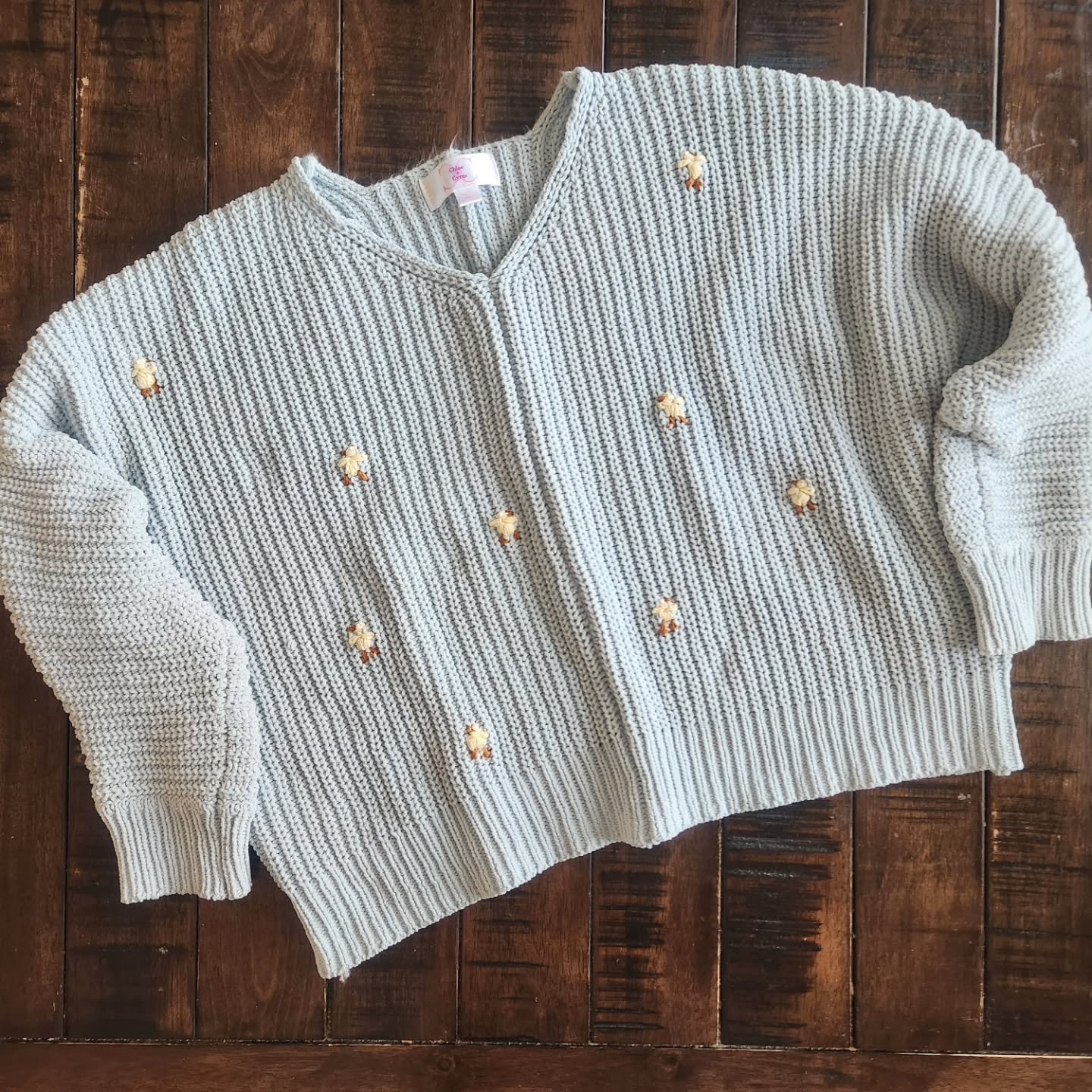 Hand embroidered yellow chicks on light blue cropped knit sweater