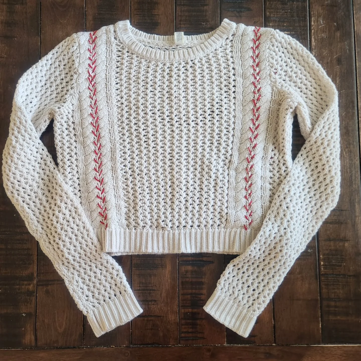 Batter up!  Red baseball stitching on upcycled cropped knit sweater.