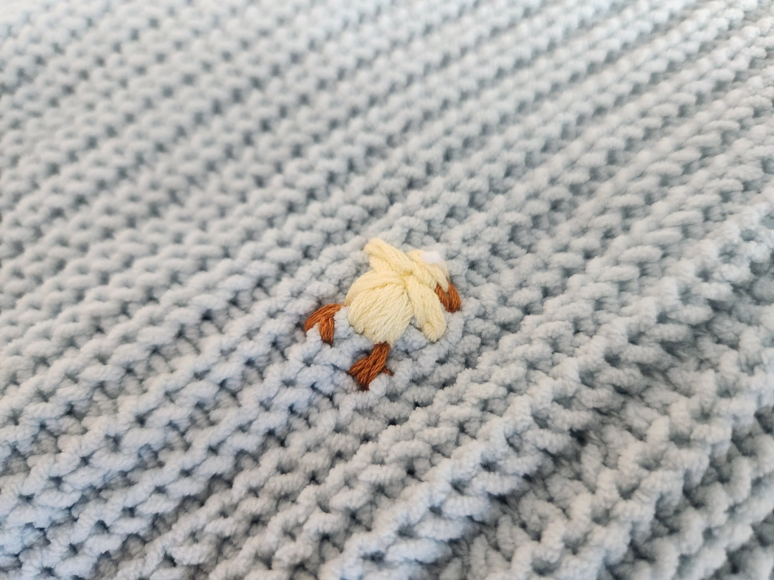 Of Character embroidered chicks detail on upcycled blue cropped knit sweater.jpg