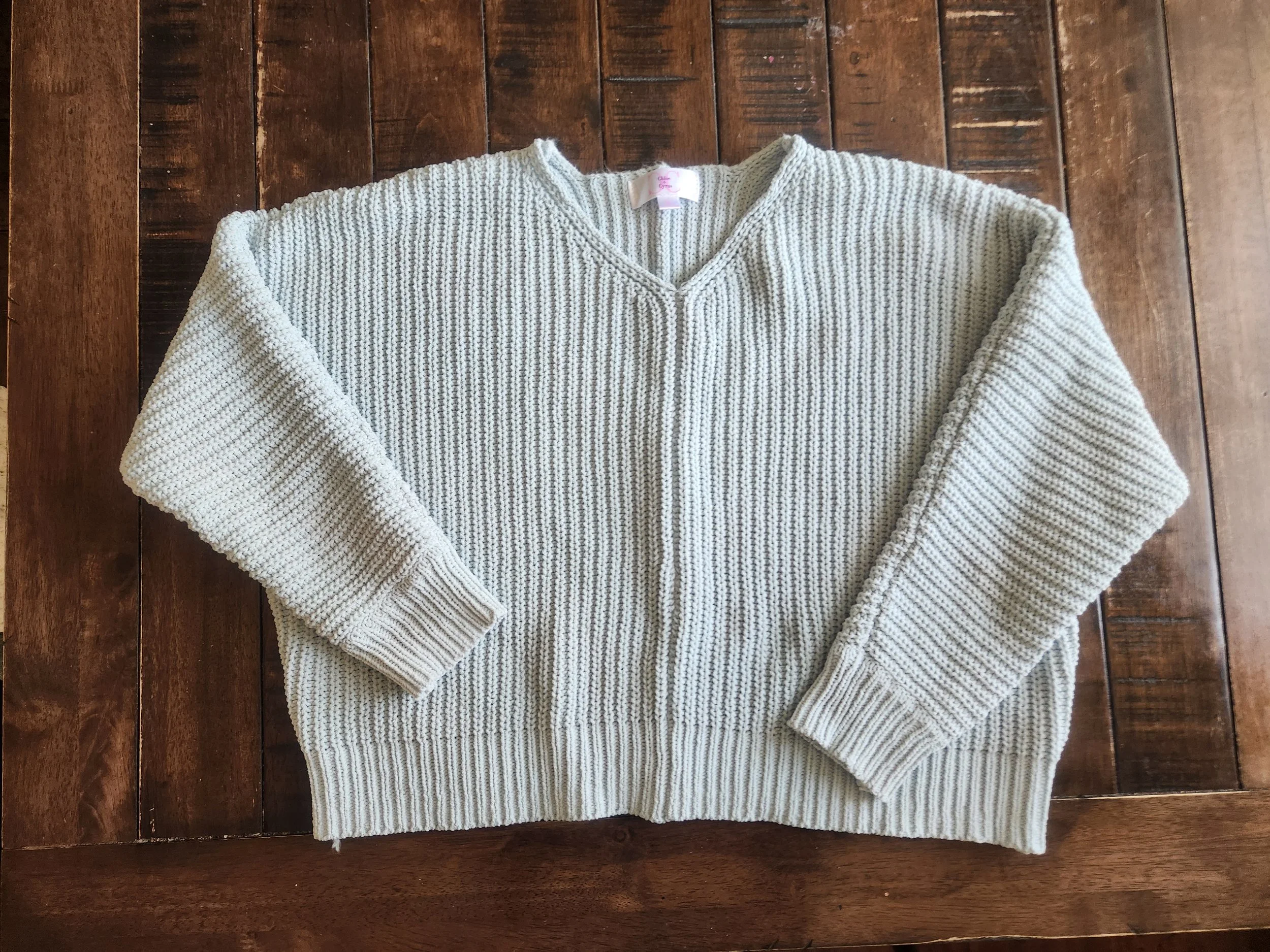 Of Character upcycled blue sweater before.jpg