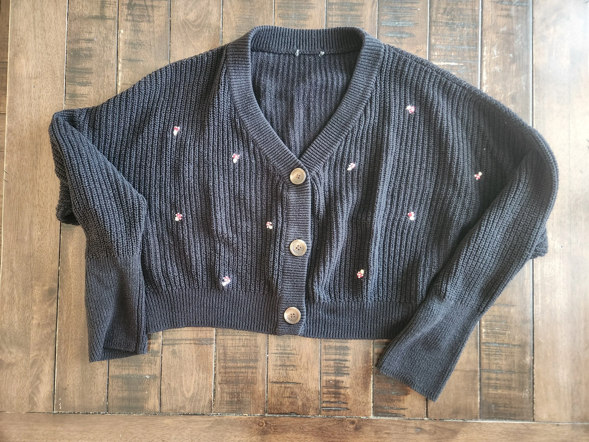 Of Character embroidered mushrooms on upcycled black cropped cardigan.jpg
