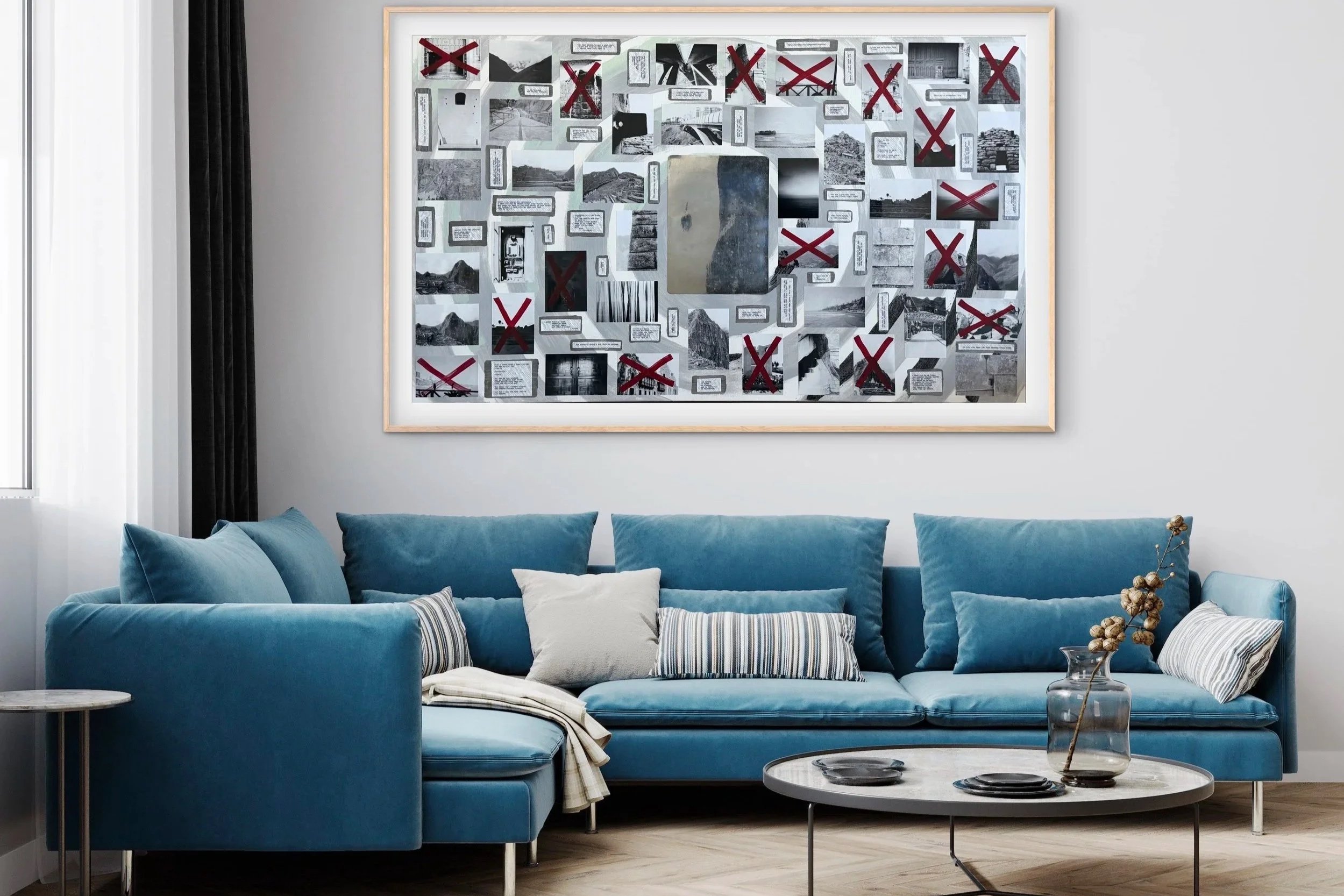 Modern living room with a blue velvet sofa, decorative pillows, and a marble coffee table. Wall art features a collage of black-and-white photos and crossed-out symbols. Dark curtains are on the left side, and a window allows natural light.