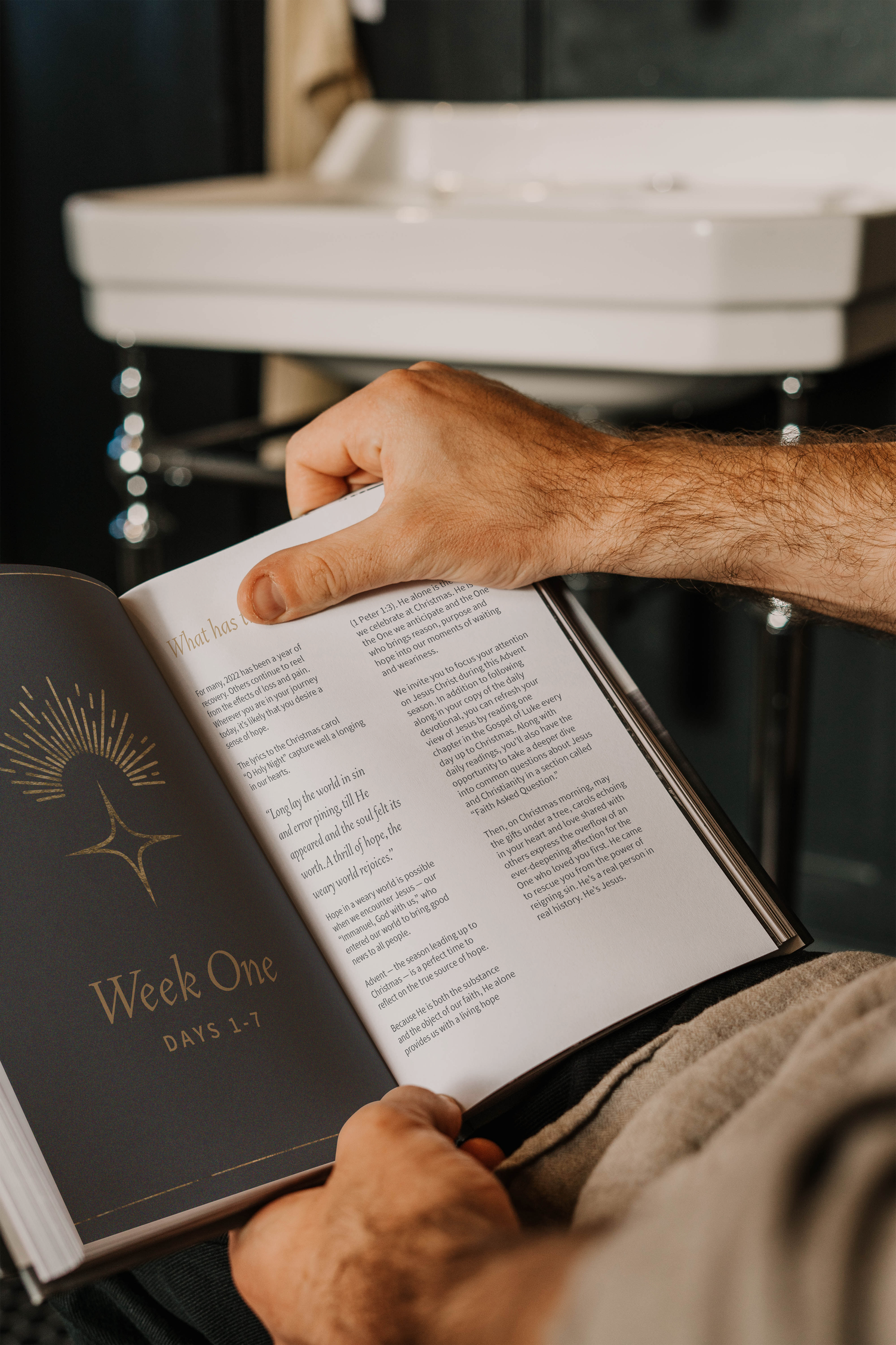 opened+book+in+hand+mockup.png.webp