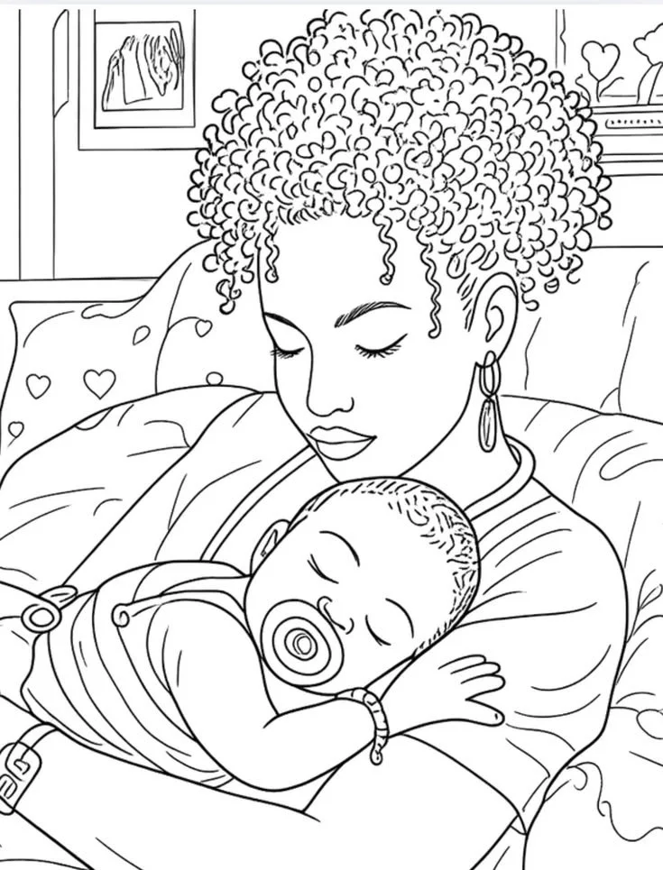 A woman with curly hair holding a sleeping baby with a pacifier, sitting on a bed in a room with framed art and a shelf with a heart-shaped decoration.