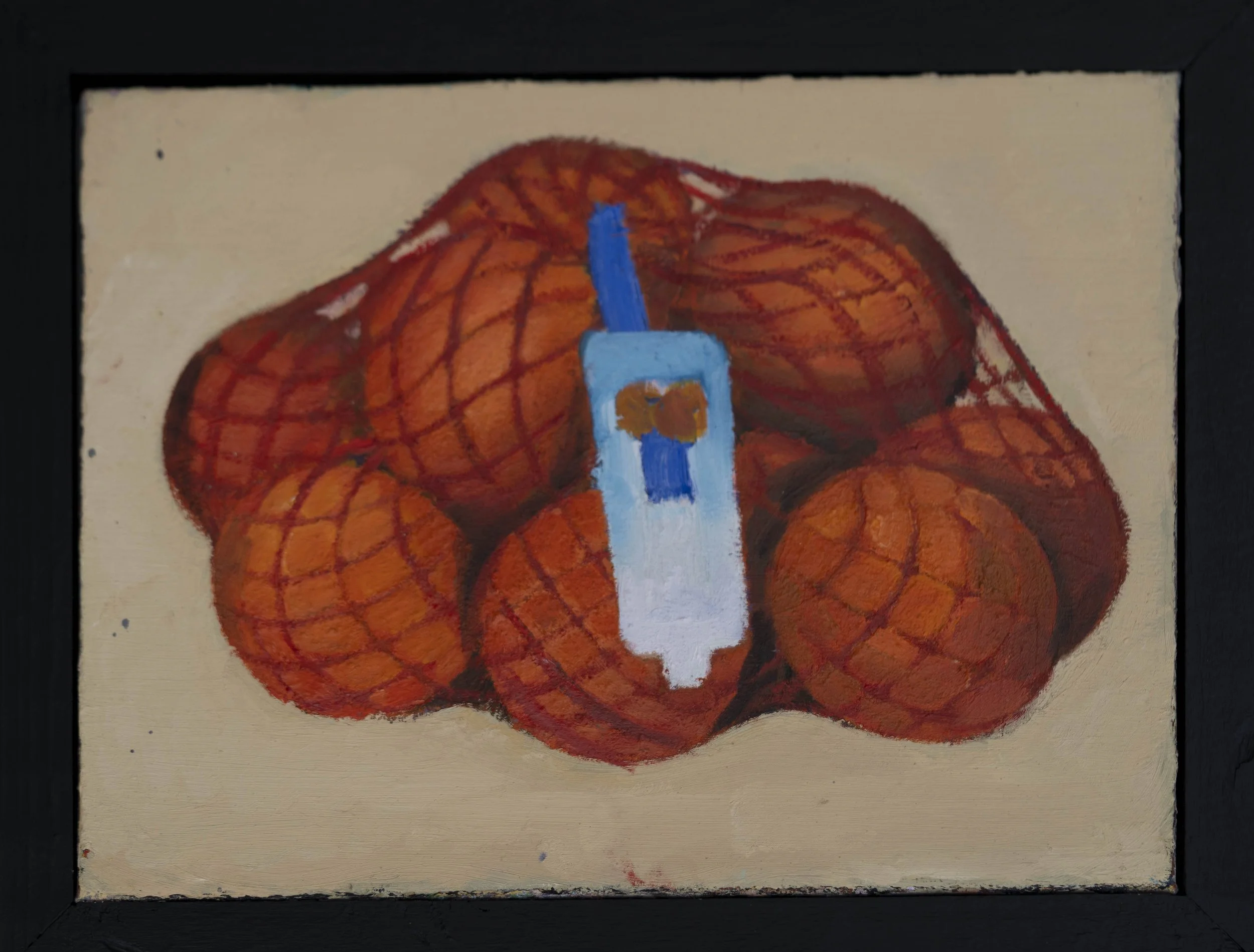 A framed painting of oranges in a bag on a tan background.